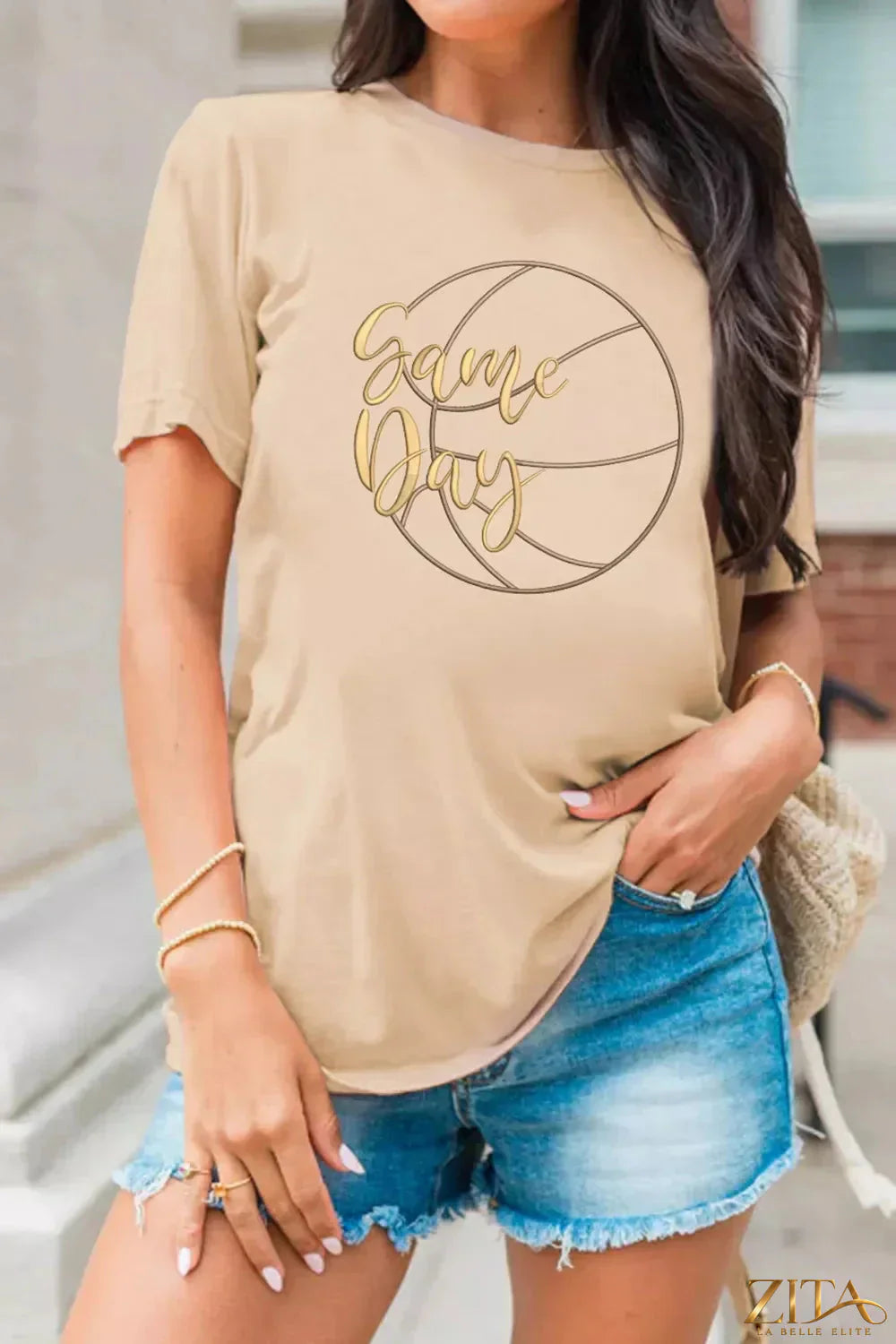 Basketball graphic T-shirt by Trendsi featuring a sporty game day design, perfect for casual athletic style.