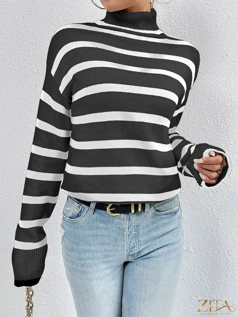 Striped turtleneck long sleeve sweater by Trendsi, featuring a fitted design with multicolor horizontal stripes and ribbed cuffs.