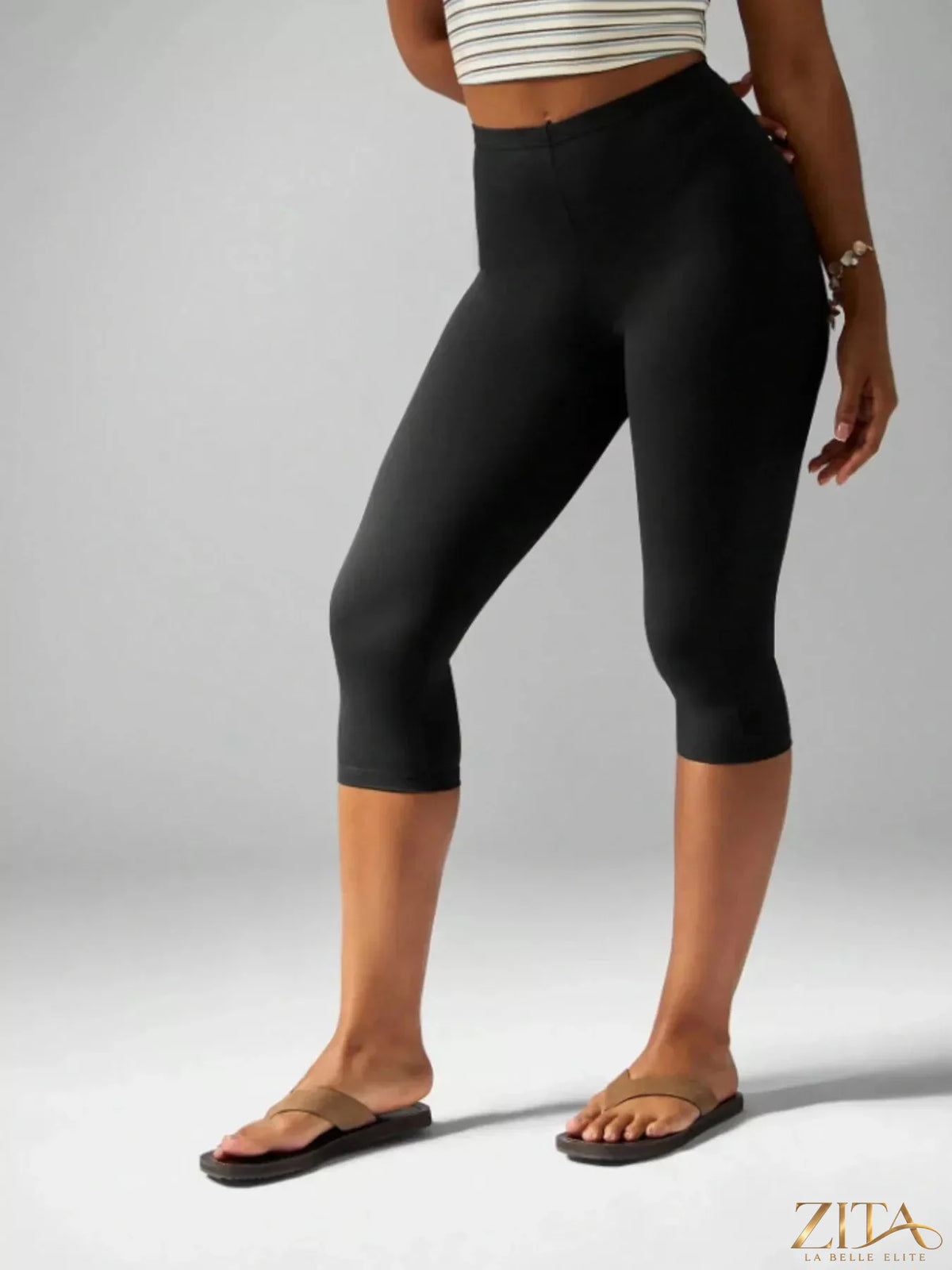 High-waisted Zita La Belle Elite active capri leggings featuring a sleek black design and comfortable stretch fabric.
