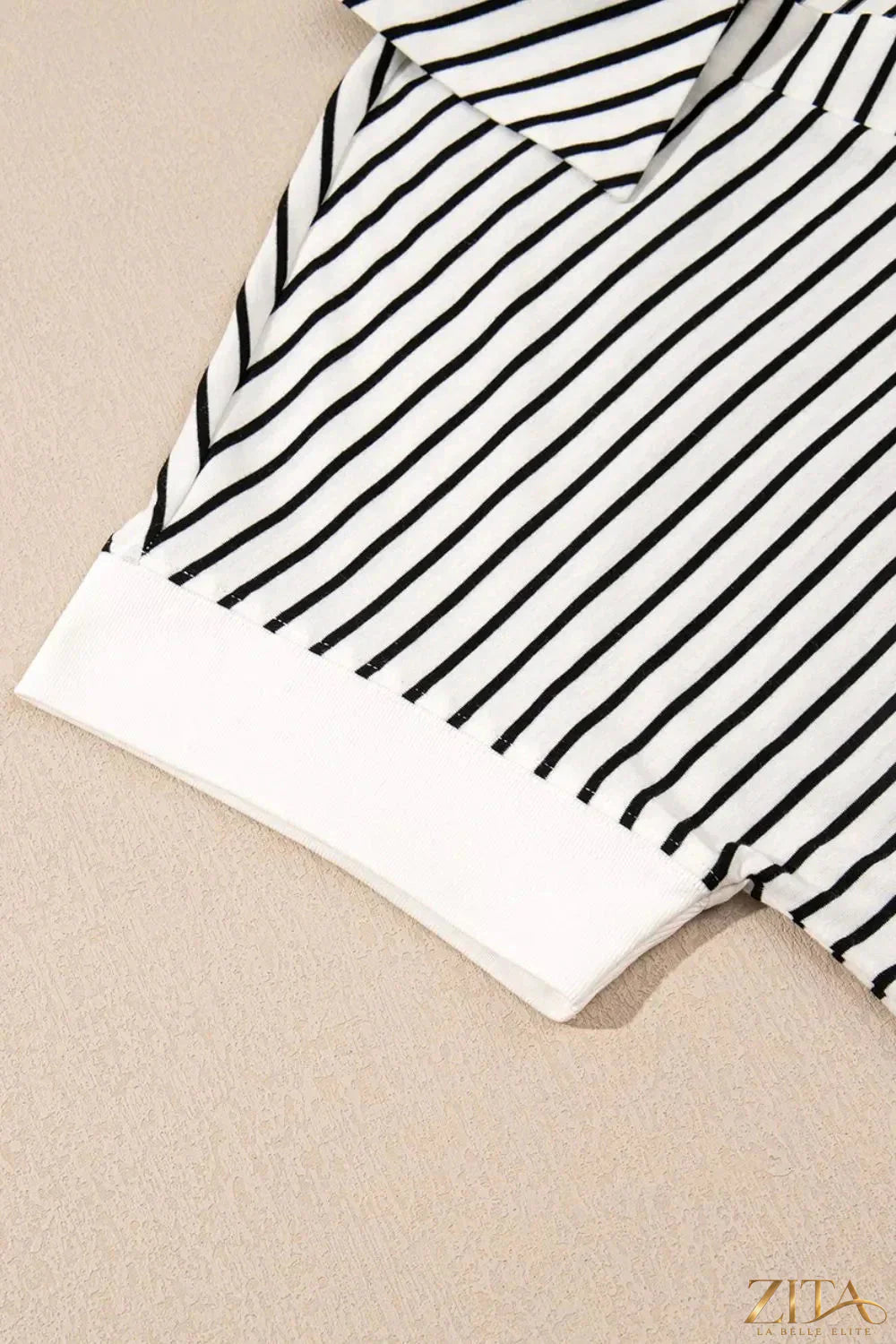 Stripe V neck tee and casual shorts two-piece set from Trendsi, featuring a striped top and matching shorts on a neutral background.