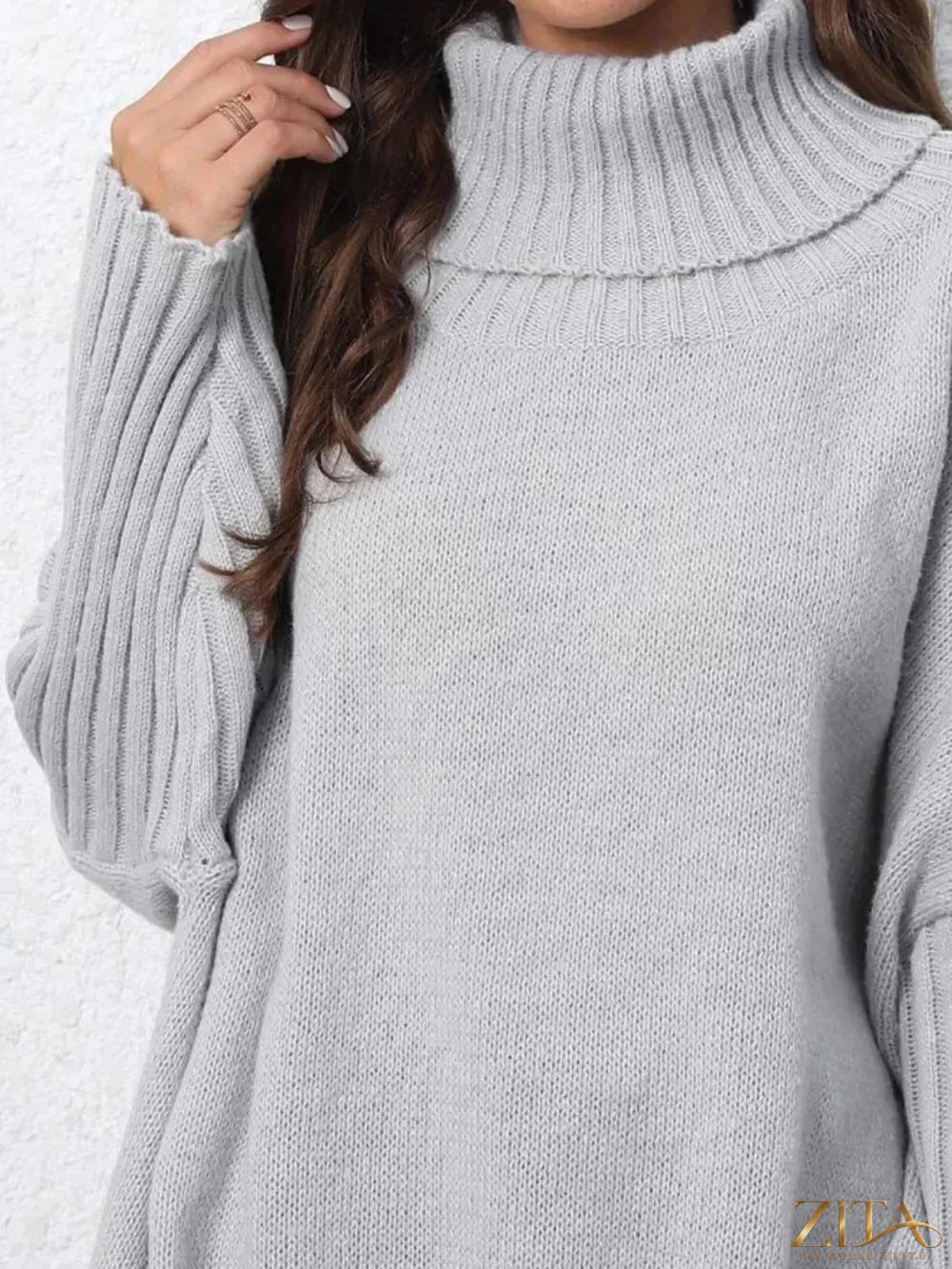 Black turtleneck long sleeve sweater by Trendsi, close-up of soft knit fabric and fitted style on a mannequin.