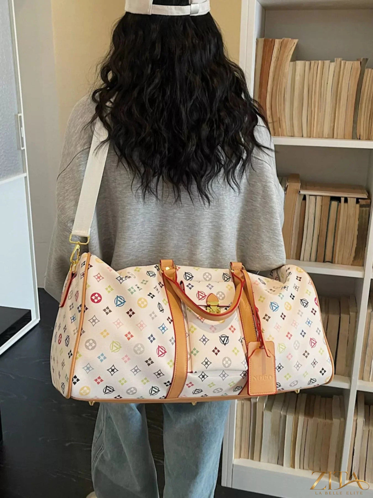 Printed leather travel bag by Trendsi featuring stylish design, sturdy handles, and spacious interior for travel essentials.