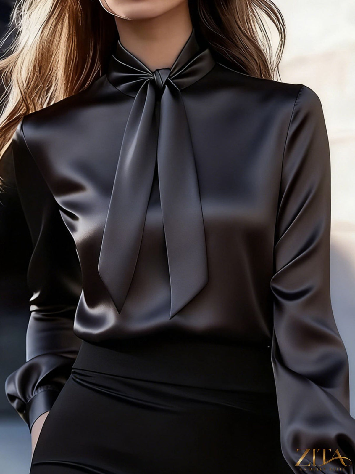 Zita La Belle Elite satin bow tie long sleeve blouse with front bow detail and elegant design, shown in a close-up view.