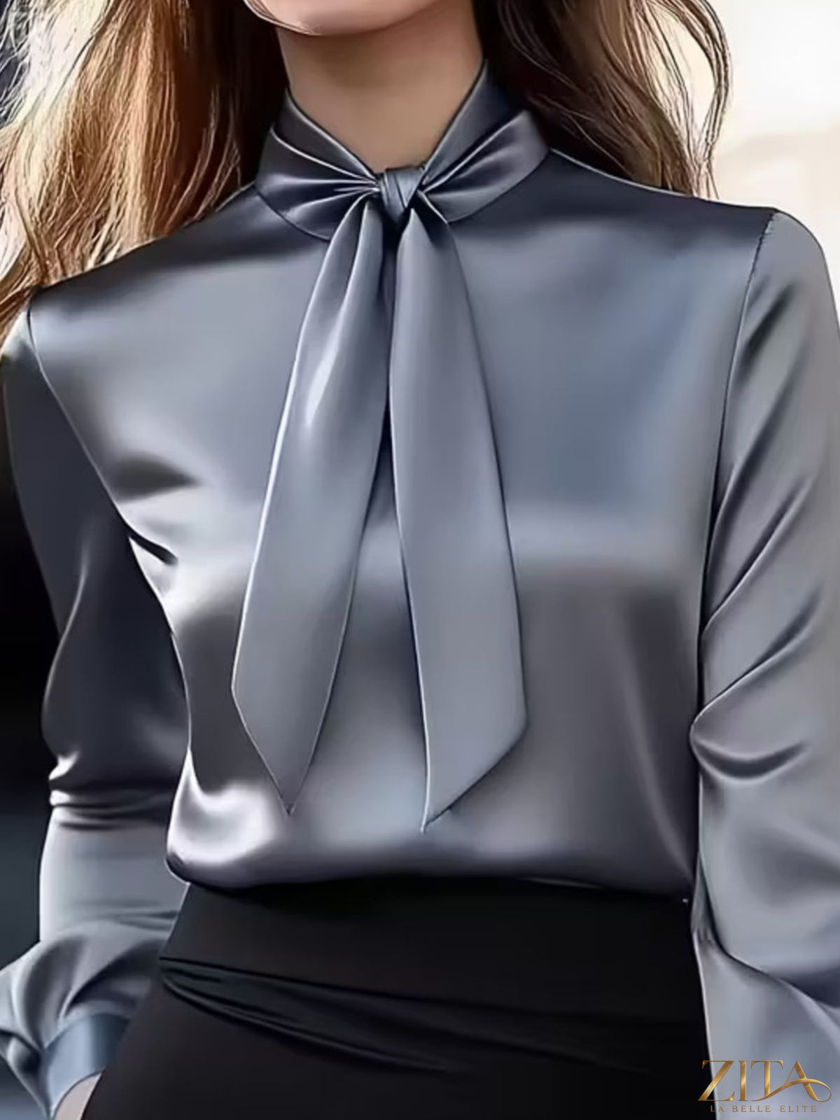 Zita La Belle Elite satin bow tie long sleeve blouse with a relaxed fit, featuring a front bow detail and elegant fabric.