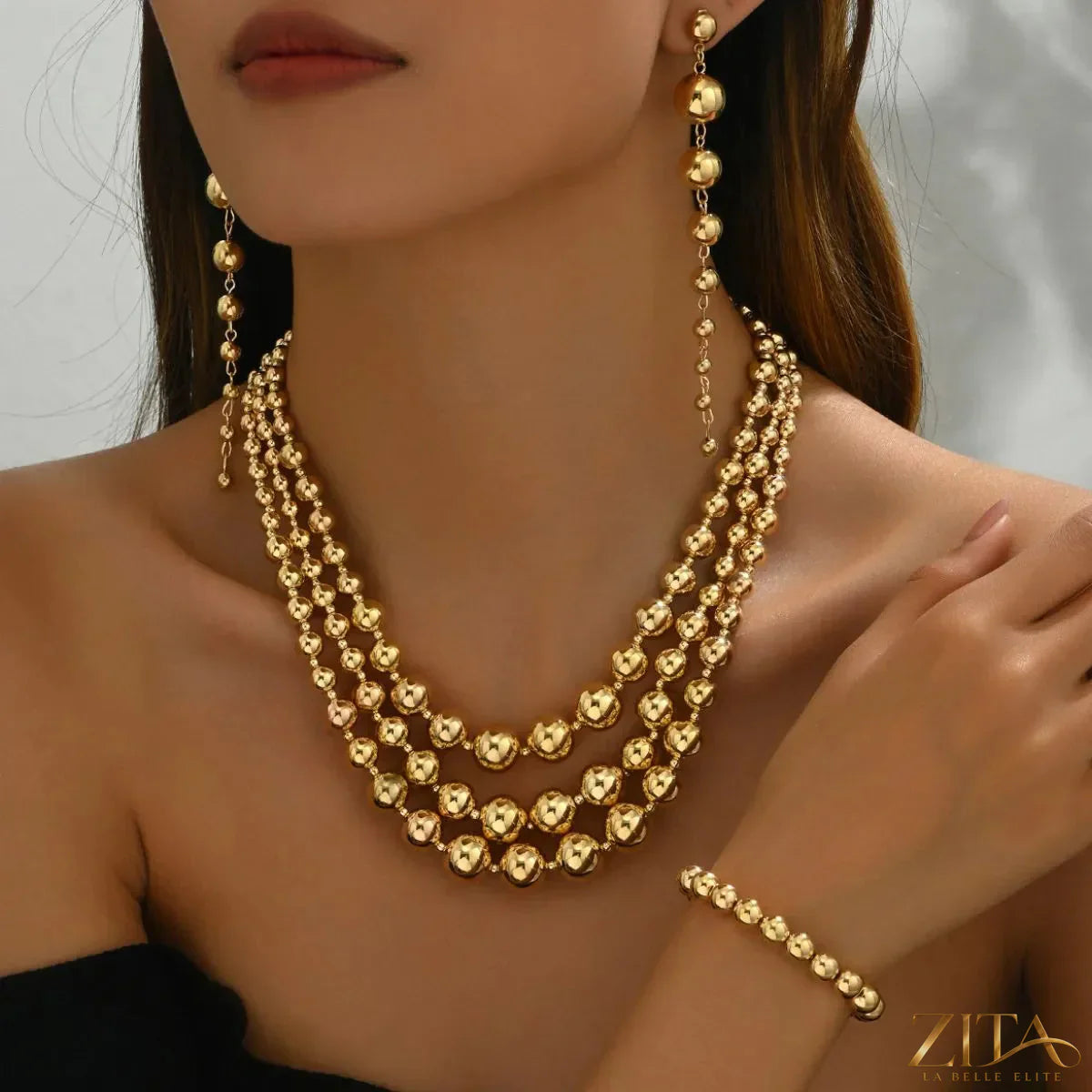 18K gold-plated layered beaded jewelry set by Zita La Belle Elite featuring multiple beaded strands and elegant design.