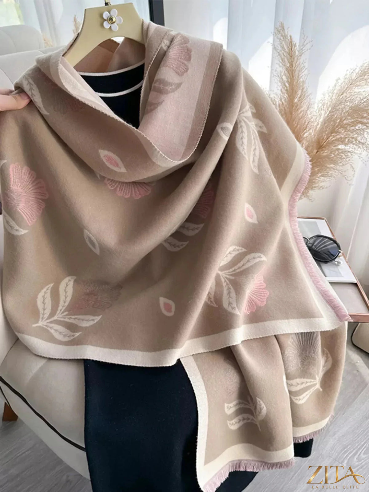 Printed raw hem shawl by Zita La Belle Elite featuring intricate patterns and soft fabric, draped elegantly over a neutral background.
