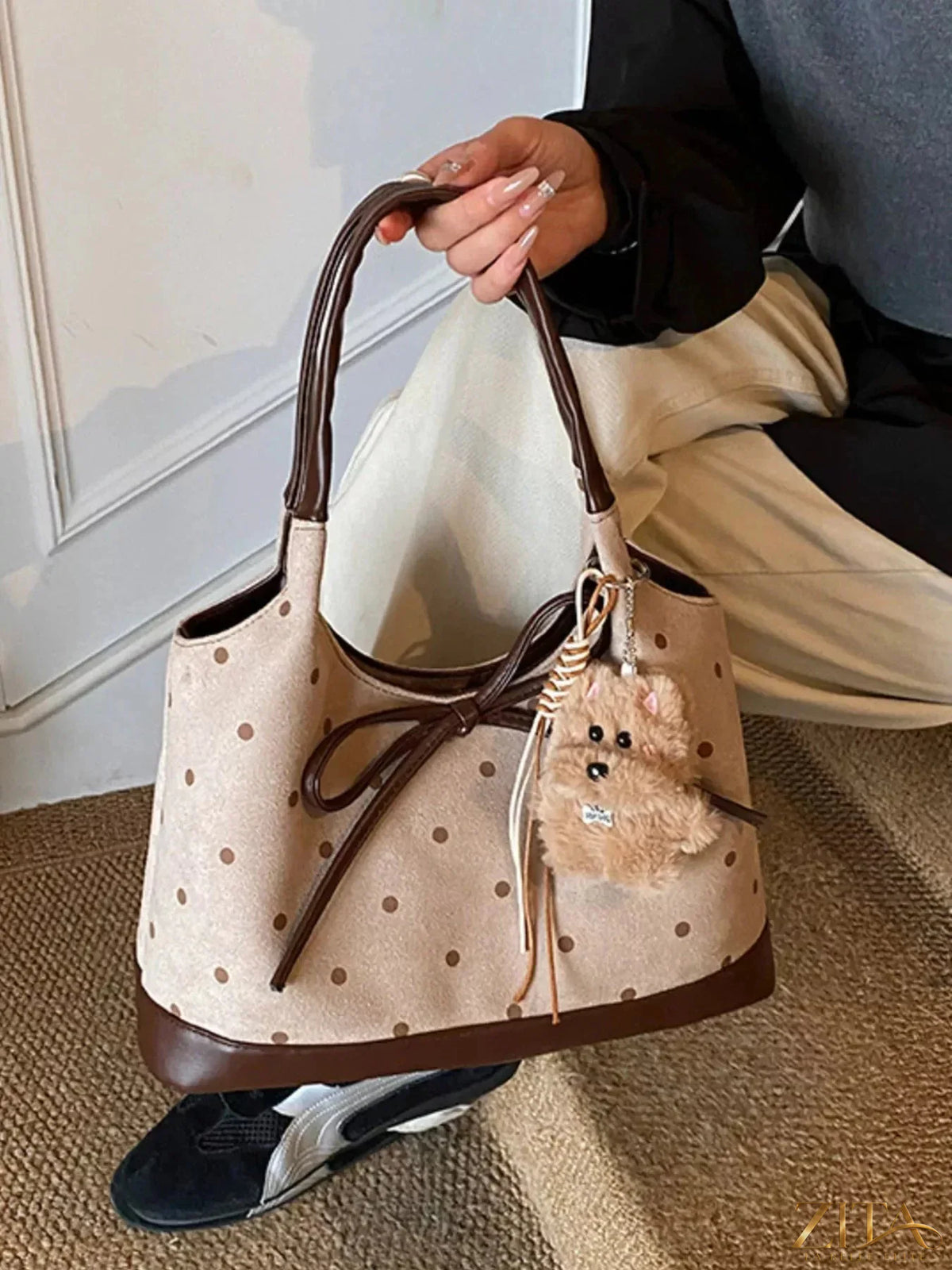 Zita La Belle Elite polka dot bow shoulder bag with adjustable strap and stylish design, featuring a prominent bow detail.