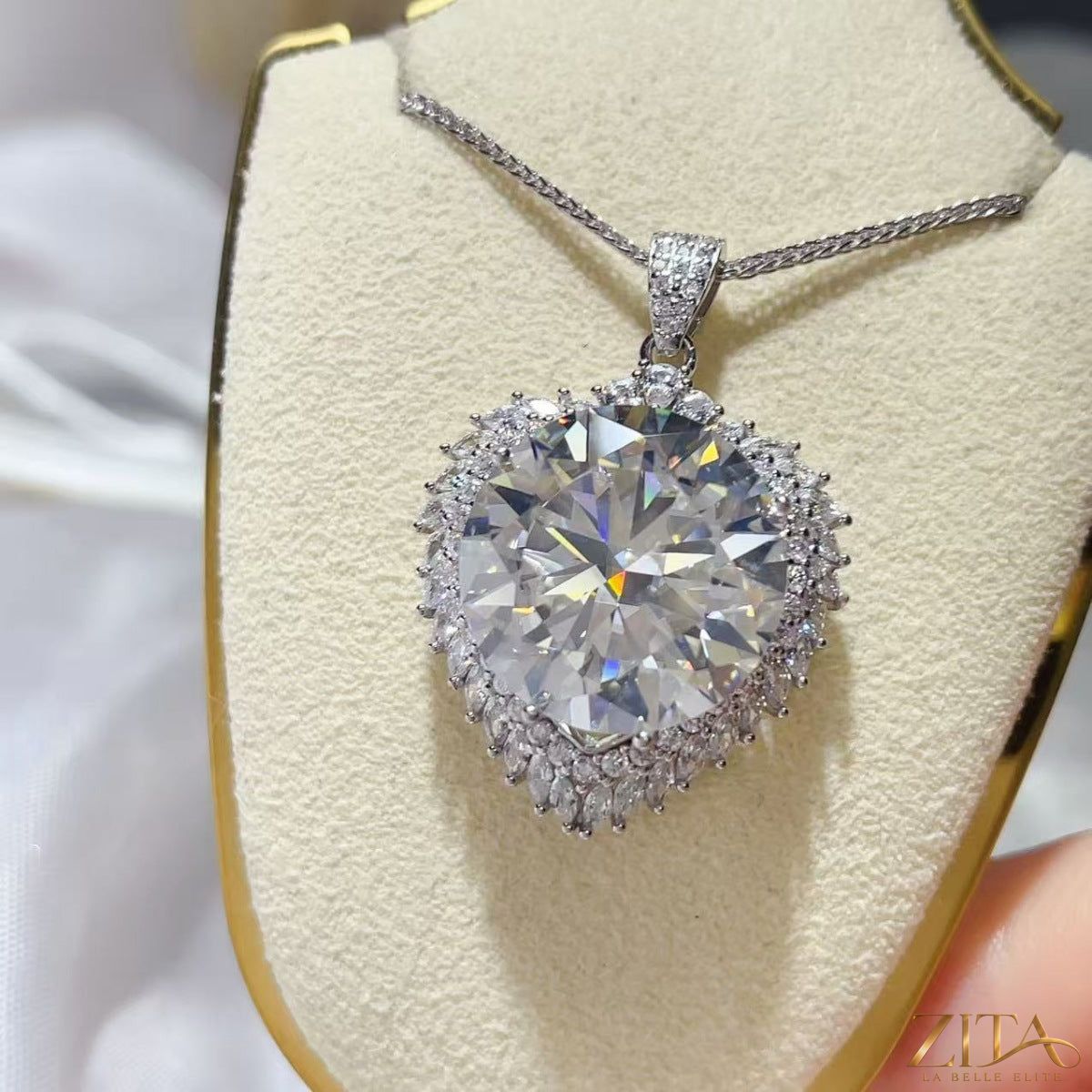 Sterling silver pendant necklace with 20 carat moissanite gemstone, elegant jewelry piece with a sparkling center stone.