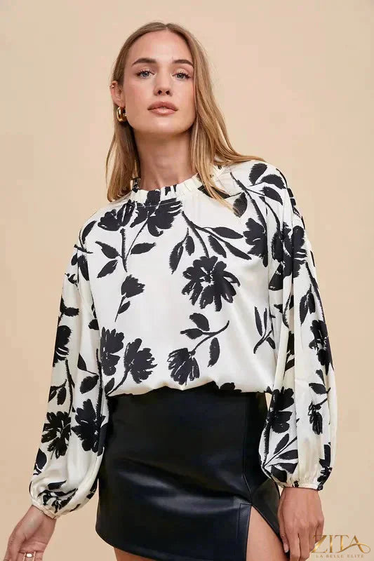Zita La Belle Elite Annie Wear frill printed balloon sleeve blouse with ruffled cuffs and floral pattern, displayed on a hanger.