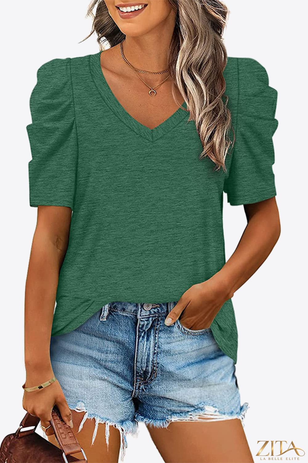 V-neck puff sleeve tee by Trendsi featuring a soft fabric, stylish puff sleeves, and a classic V-neck design.