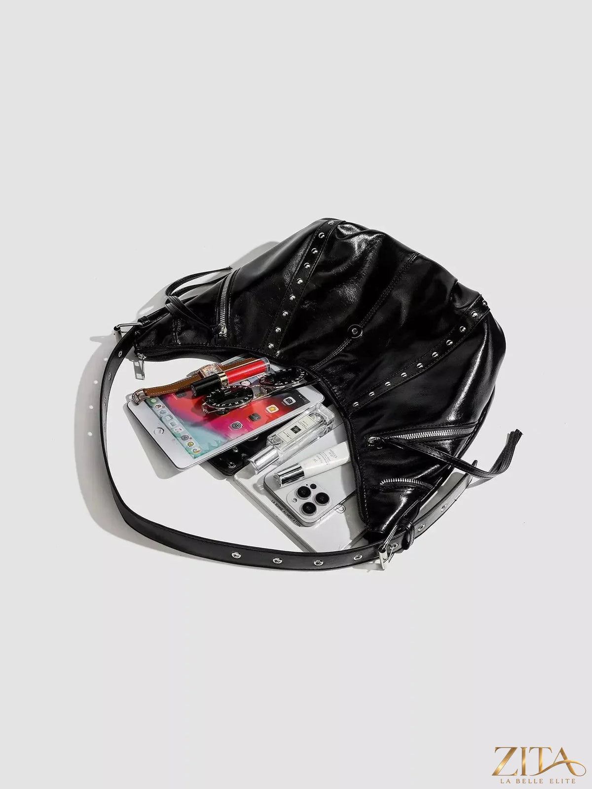 Zita La Belle Elite studded patent leather hobo shoulder bag with gold-tone hardware and adjustable strap.