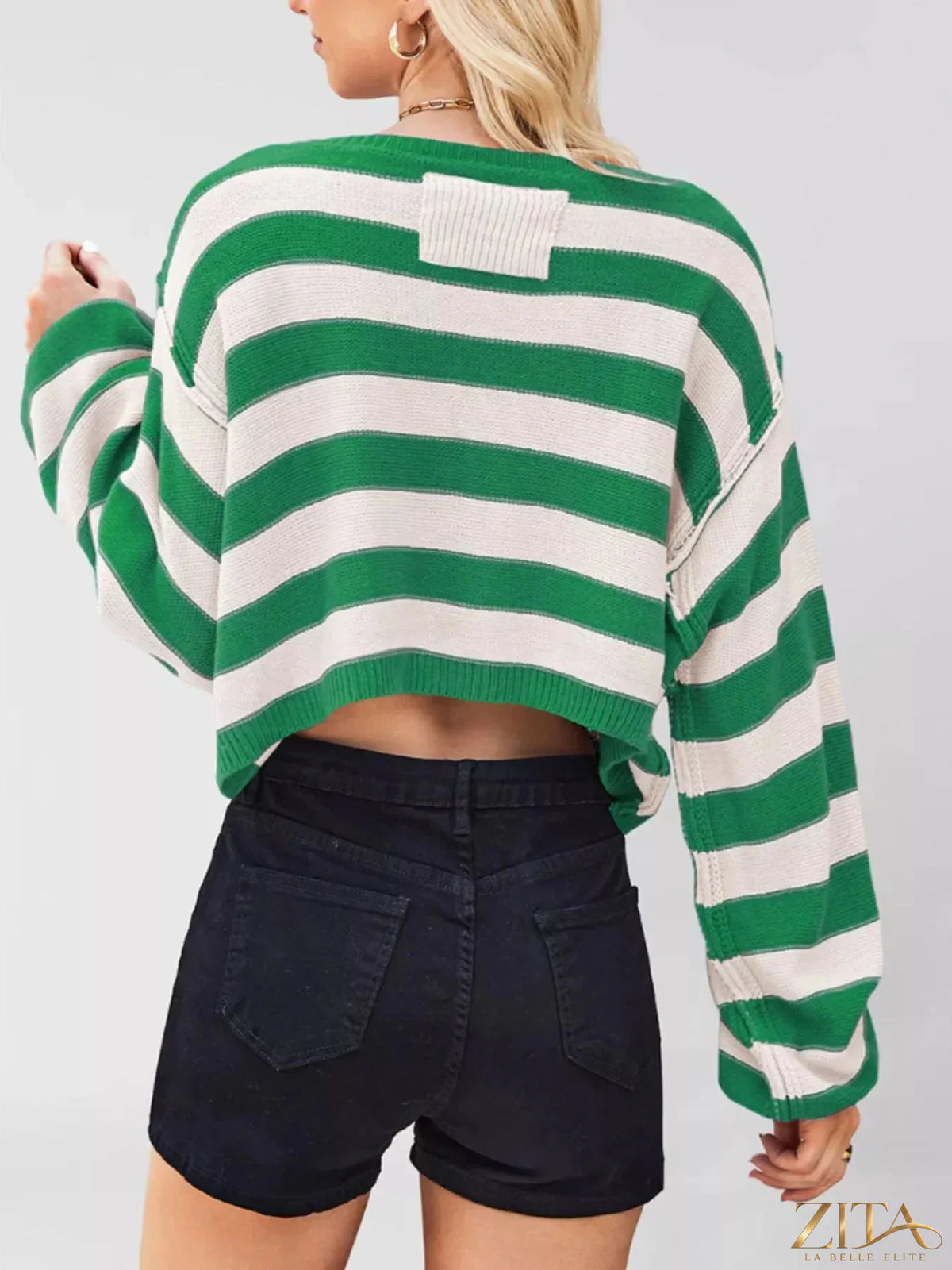 Striped boat neck sweater from Trendsi with blue, white, and navy horizontal stripes, featuring a relaxed fit and soft knit fabric.