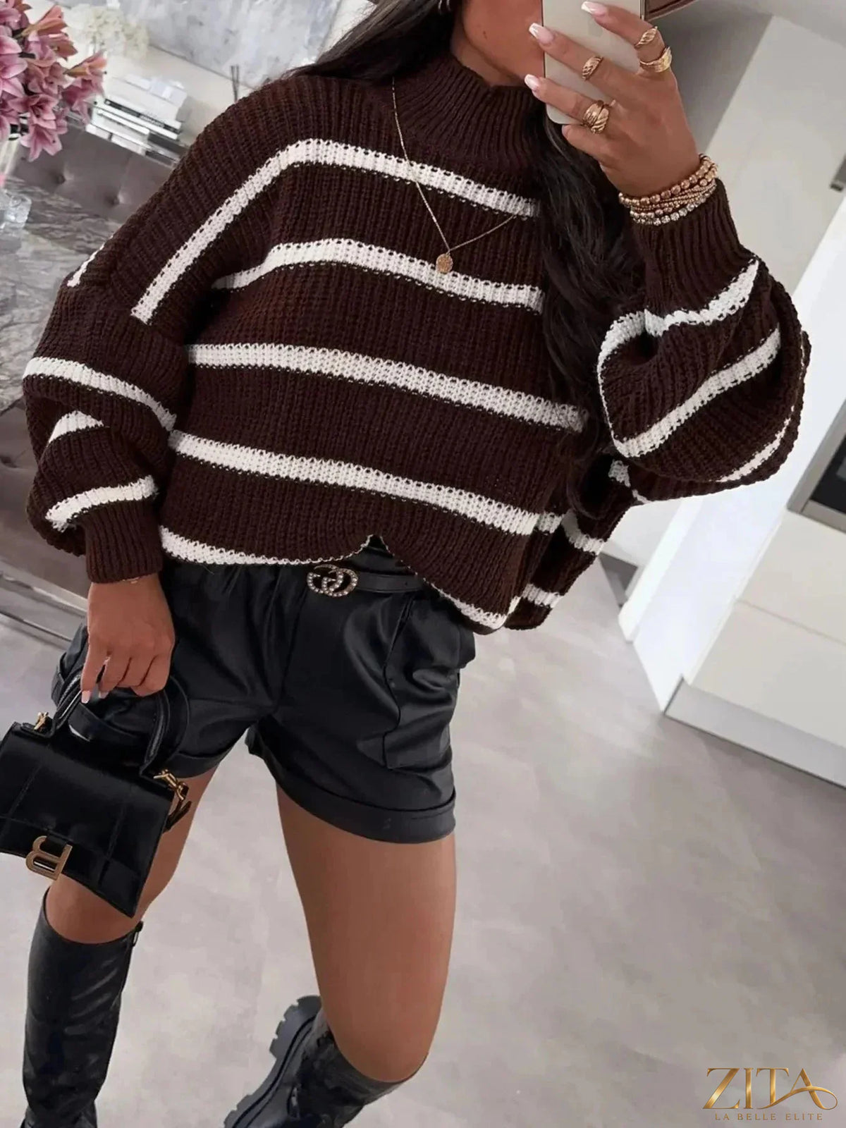 Striped turtleneck long sleeve sweater by Trendsi featuring a cozy fit and bold stripe pattern, perfect for casual winter wear.