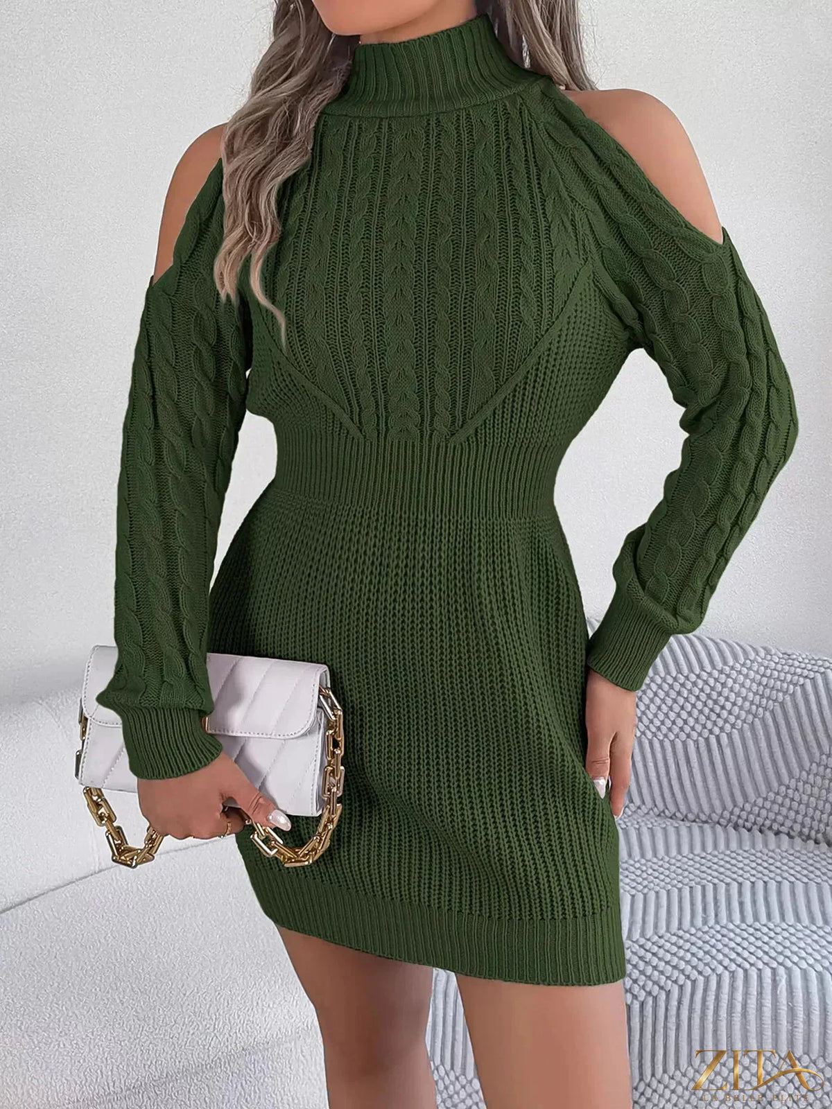 Cold shoulder cable knit turtleneck sweater dress by Trendsi, featuring a cozy design with cut-out shoulders and ribbed knit details.