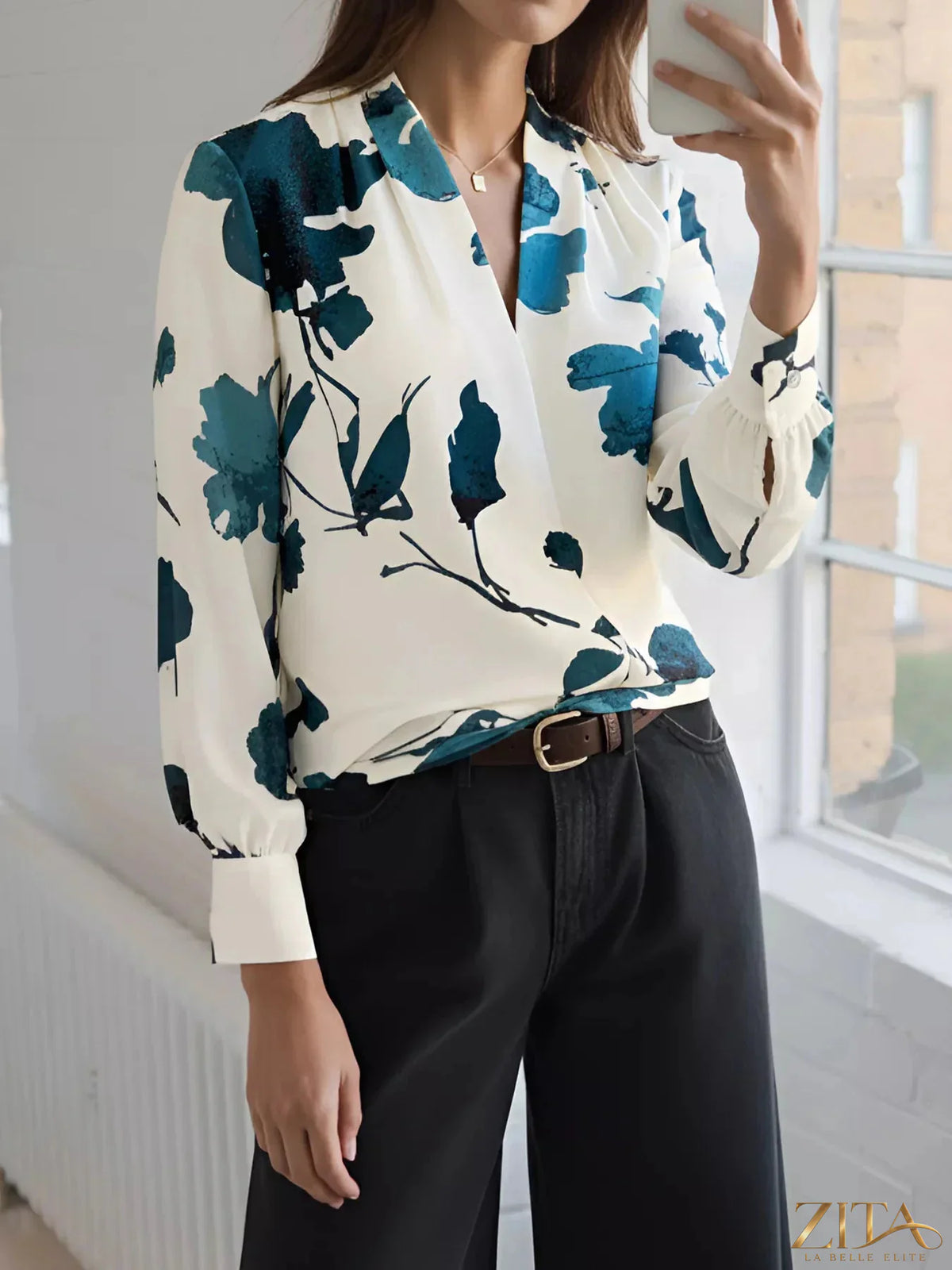 Printed V-neck long sleeve blouse by Zita La Belle Elite, featuring a stylish pattern and comfortable fit in a close-up shot.