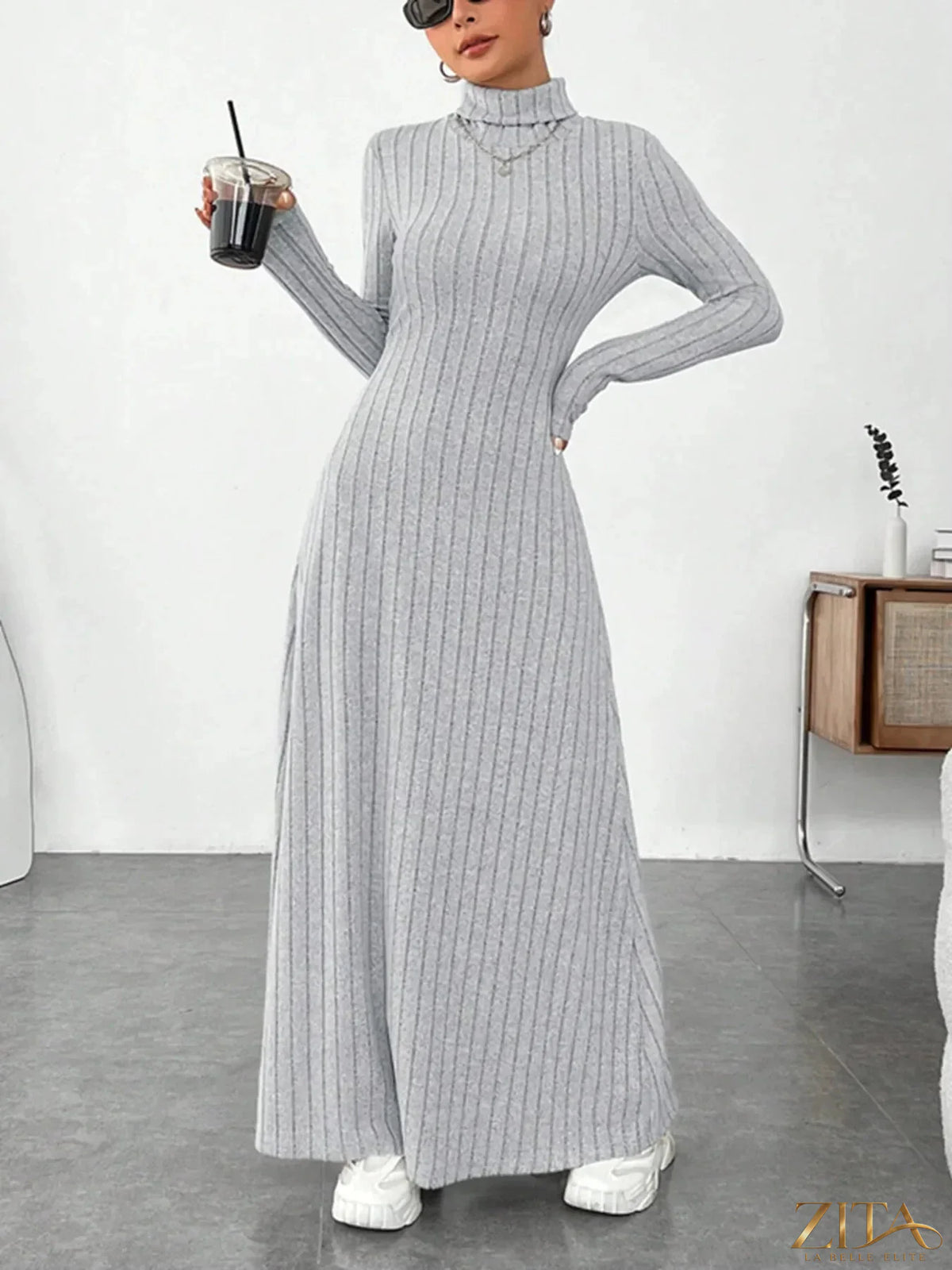 Ribbed black turtleneck long sleeve maxi knit dress by Trendsi, close-up of fitted ribbed fabric and turtleneck design.
