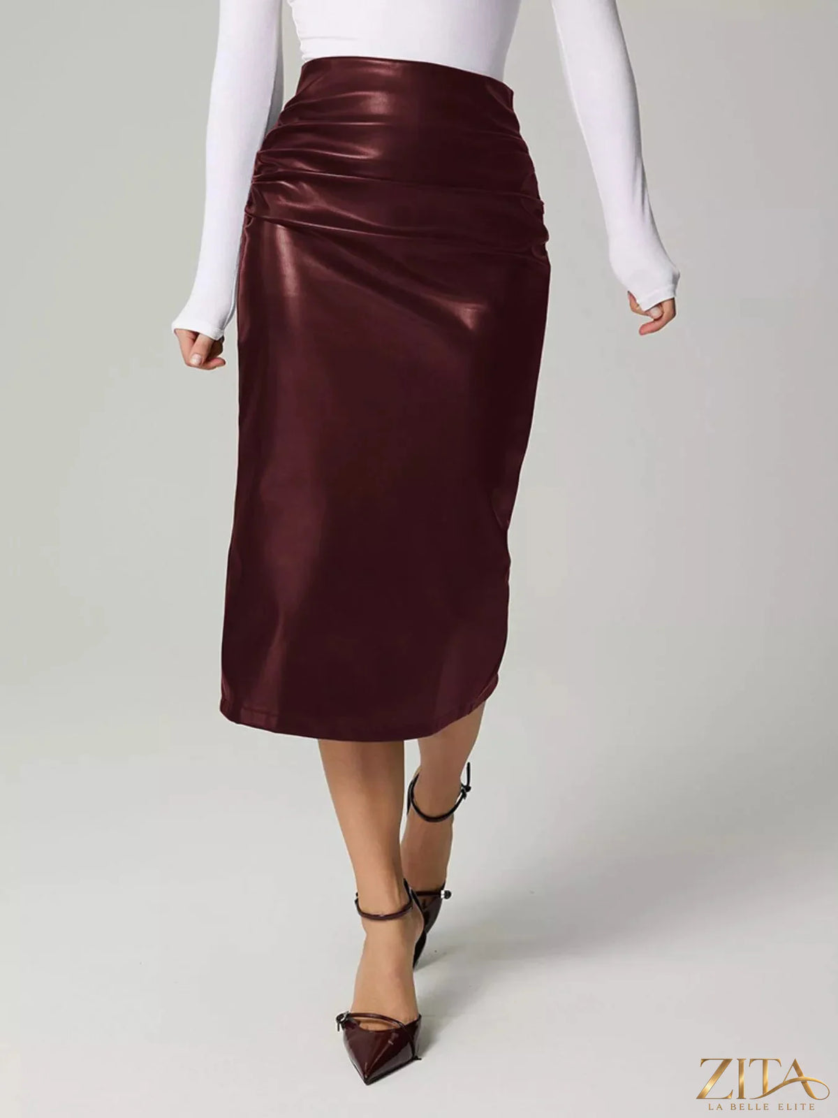 Zita La Belle Elite slit back leather skirt showing a sleek black leather design with a back slit detail.