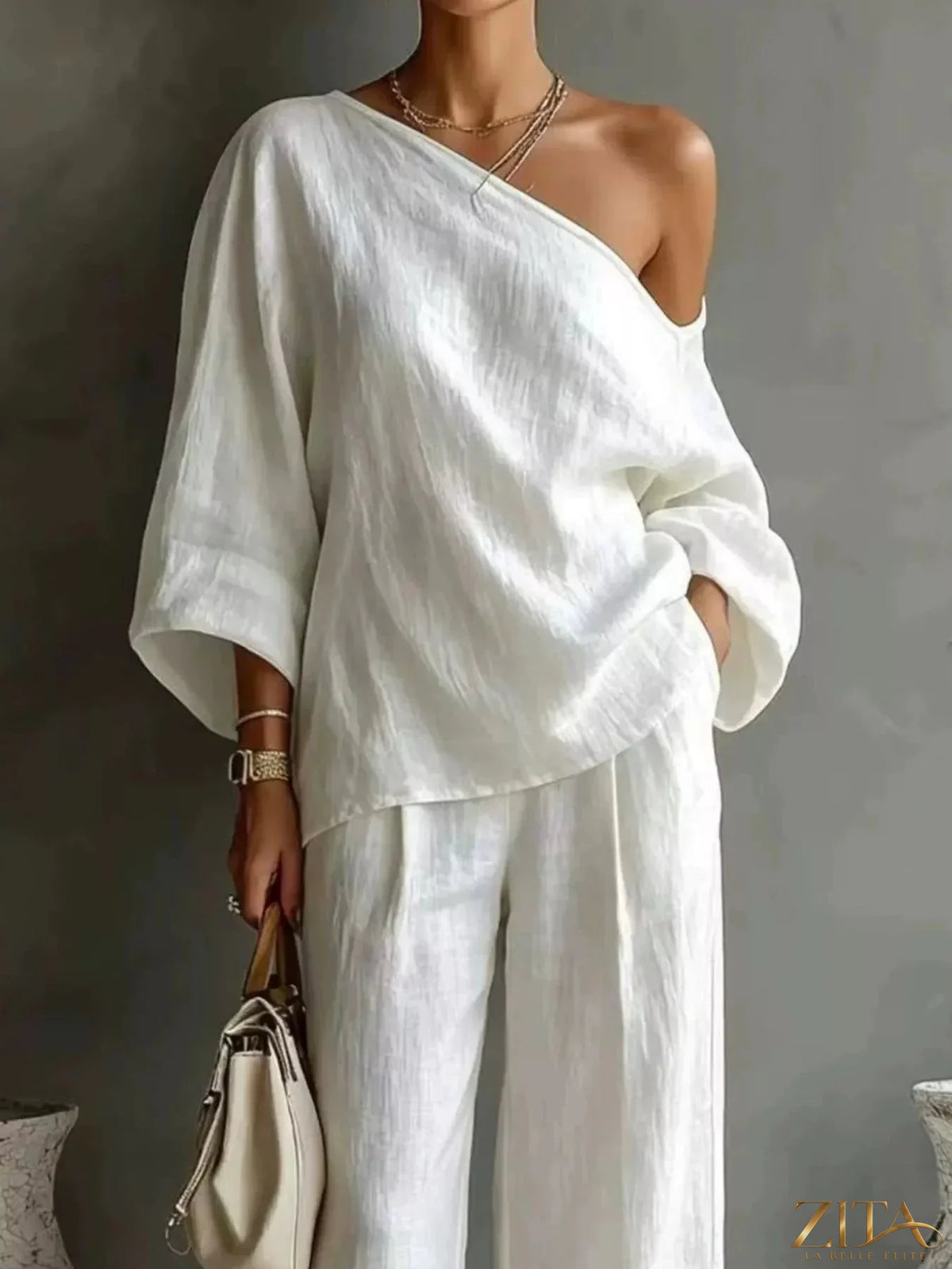 Zita La Belle Elite one shoulder top and wide leg pants set in stylish fabric, displayed on a mannequin against a neutral background.