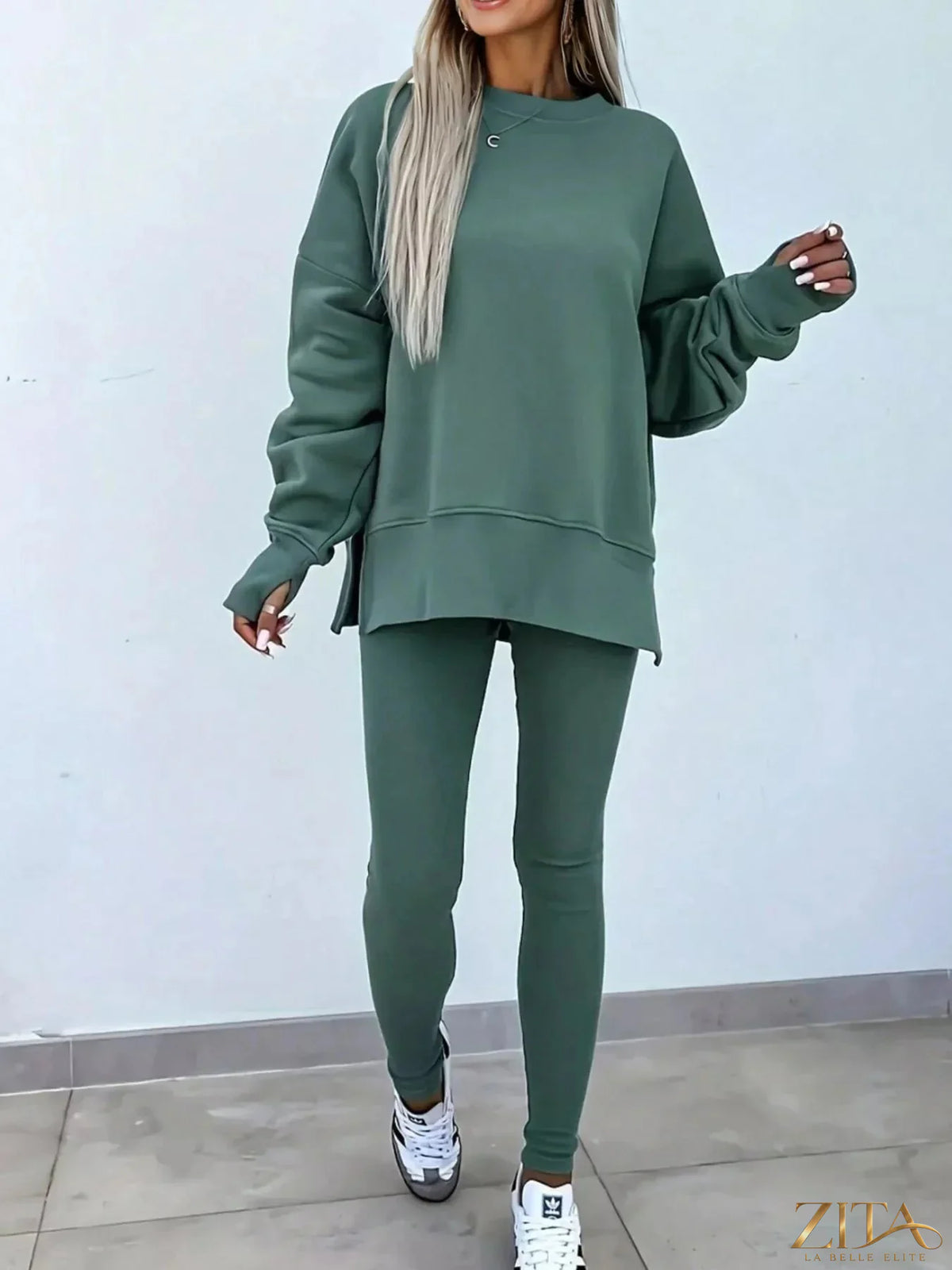 Zita La Belle Elite solid color oversized slit sweatshirt and ribbed leggings 2-piece set, shown in a casual indoor setting.