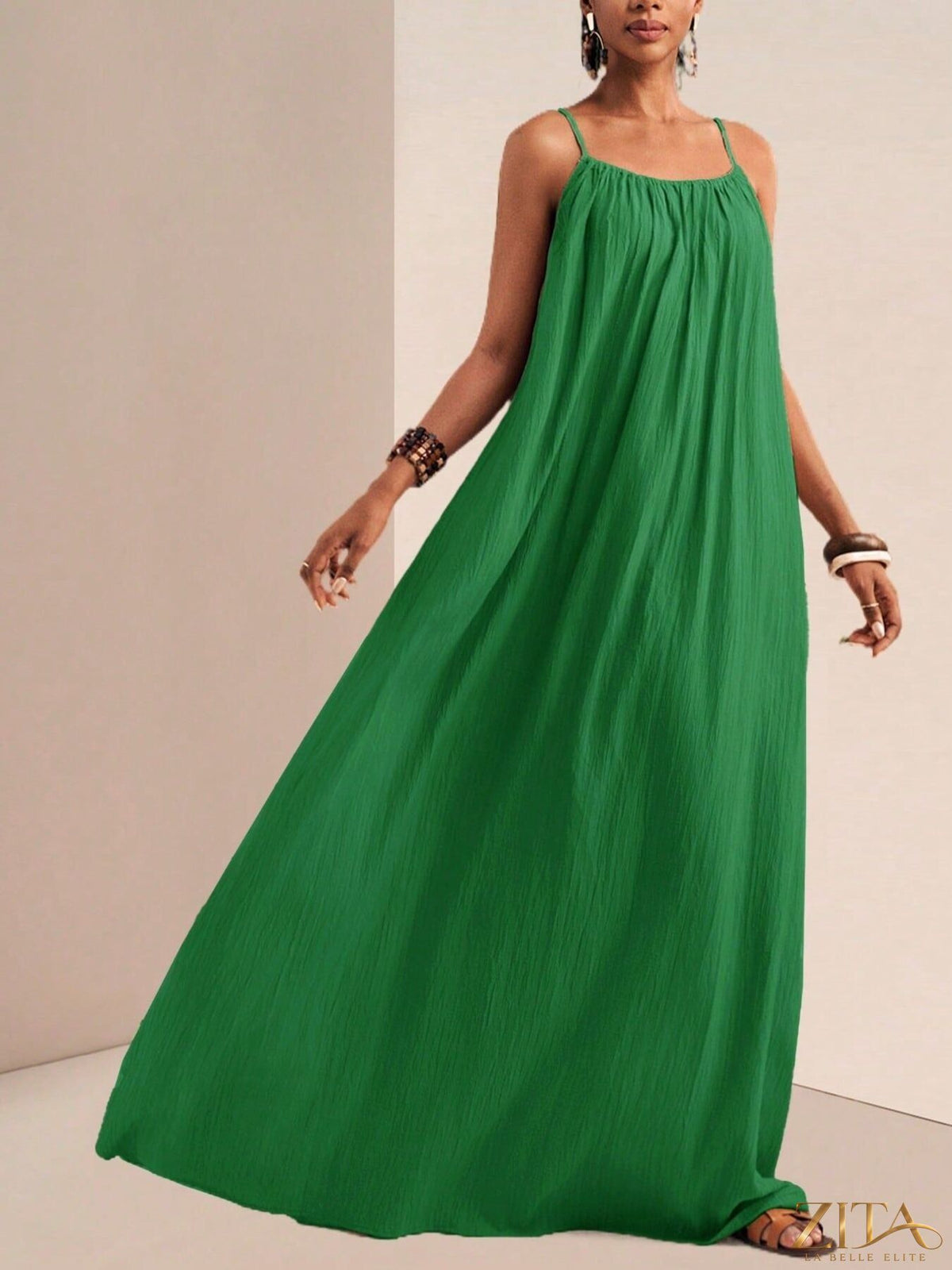 Flowy spaghetti strap maxi dress by Zita La Belle Elite, featuring a lightweight, elegant design with a fitted bodice and flowing skirt.