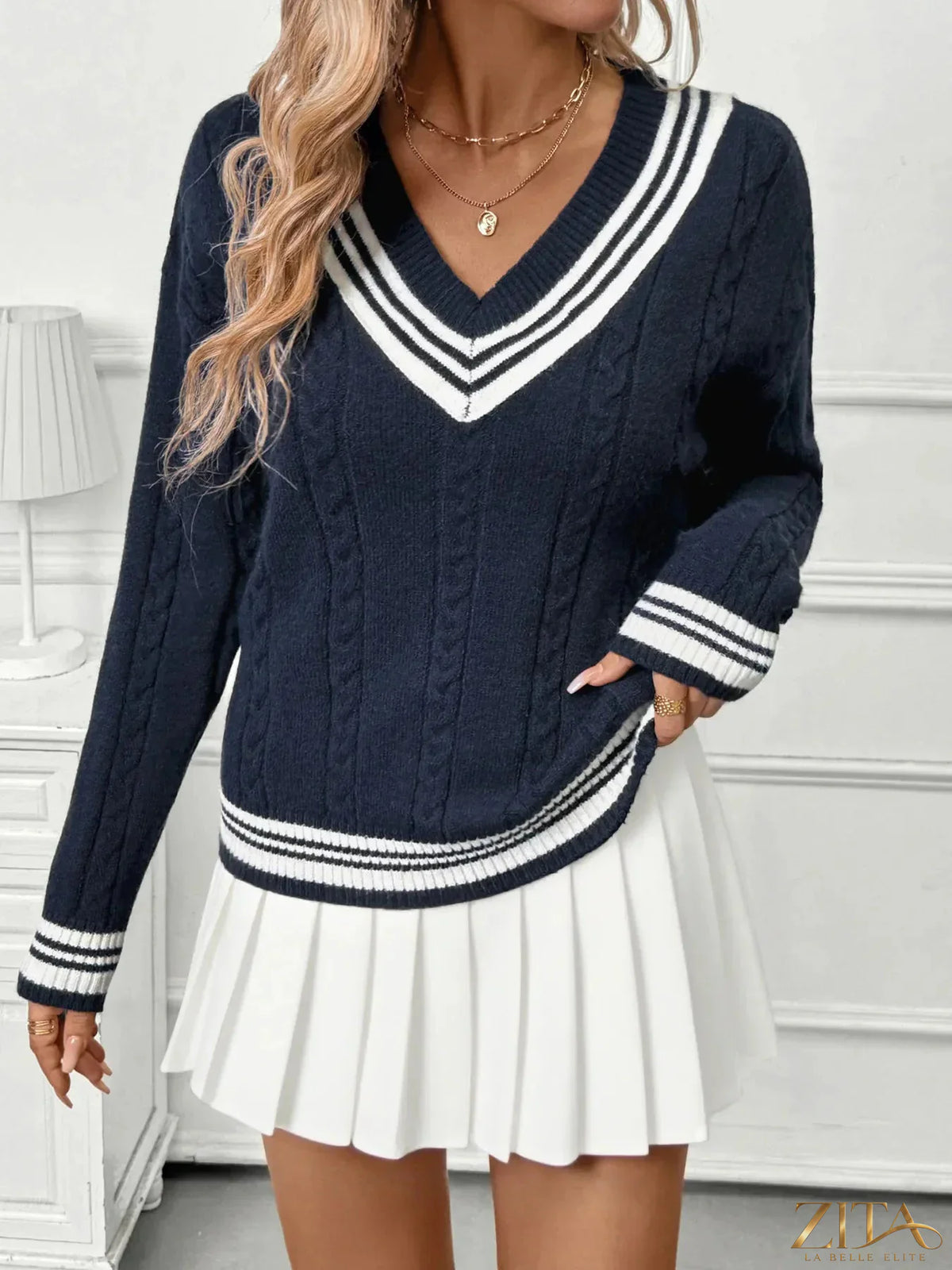 Zita La Belle Elite contrast striped V-neck sweater in black and white, showing the knit texture and stylish fit.