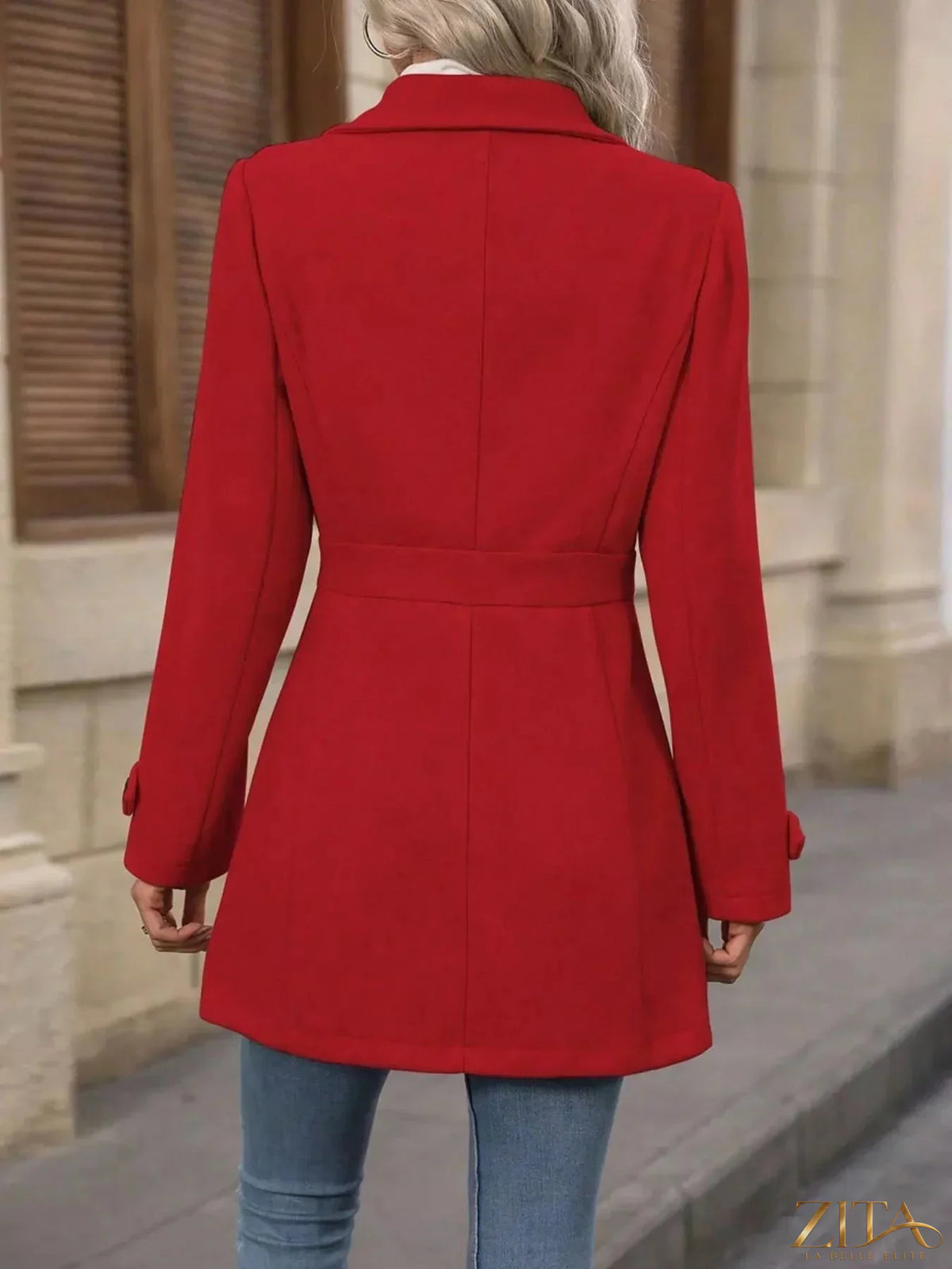 Zita La Belle Elite button-up long sleeve coat in neutral fabric, displayed on a hanger with a collar and front buttons.