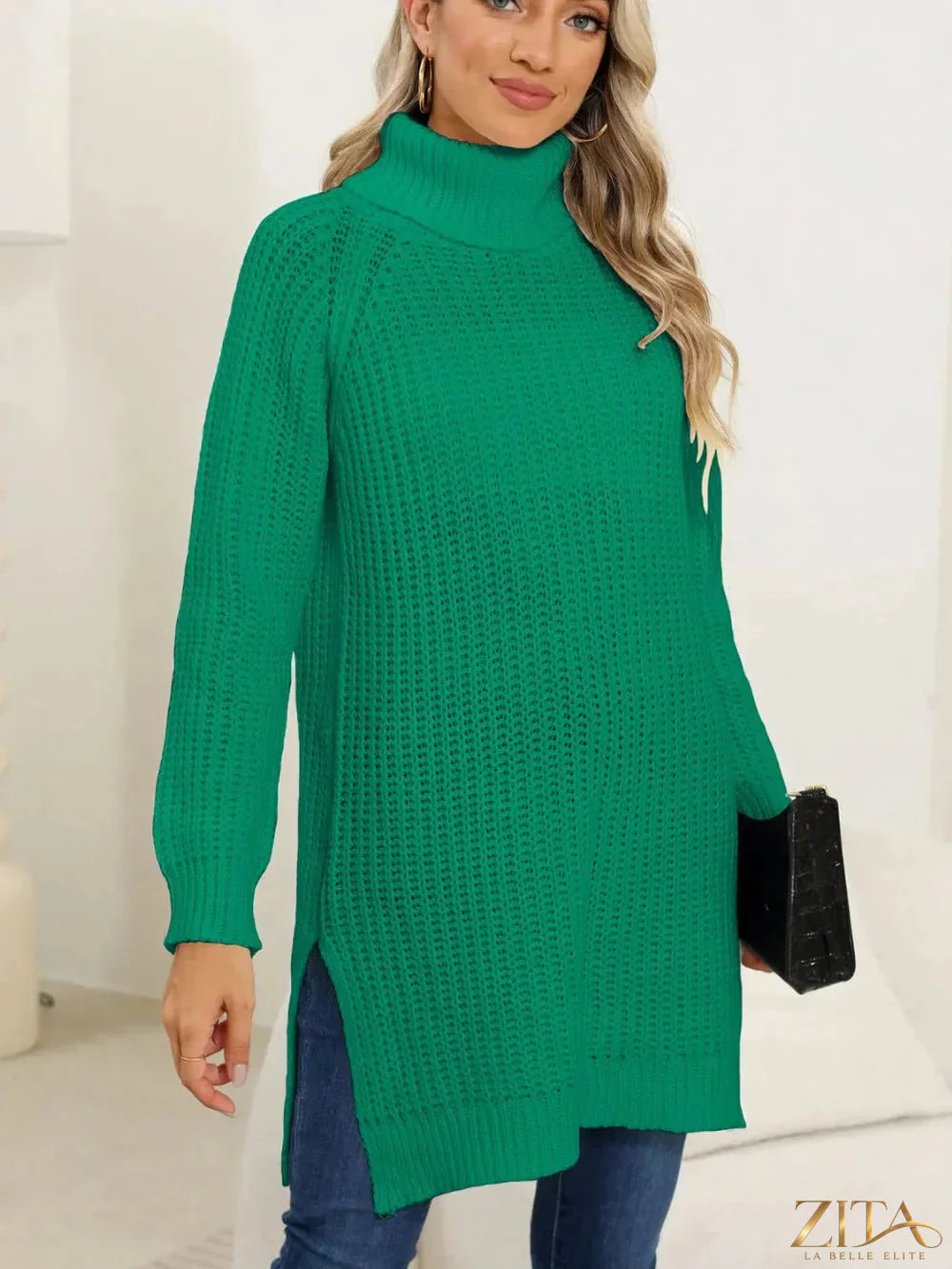 Black slit turtleneck long sleeve sweater from Trendsi, featuring a fitted design and stylish side slit detail.