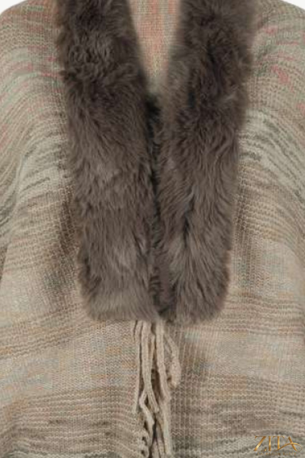 Open front fringe hem poncho by Trendsi featuring a flowy design with fringe details, perfect for layered fall outfits.