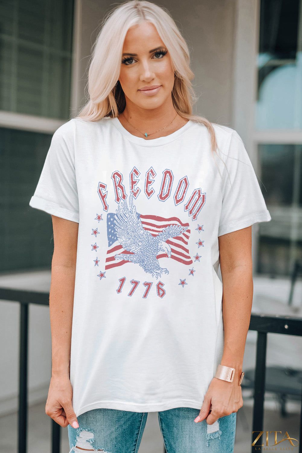 Black Freedom 1776 graphic T-shirt from Trendsi featuring patriotic design and bold lettering on front.
