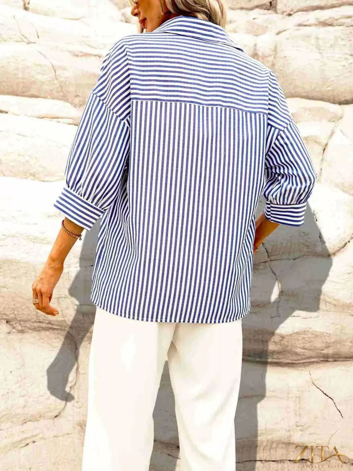 Zita La Belle Elite striped button-down shirt with a classic collar and long sleeves, featuring bold horizontal stripes.