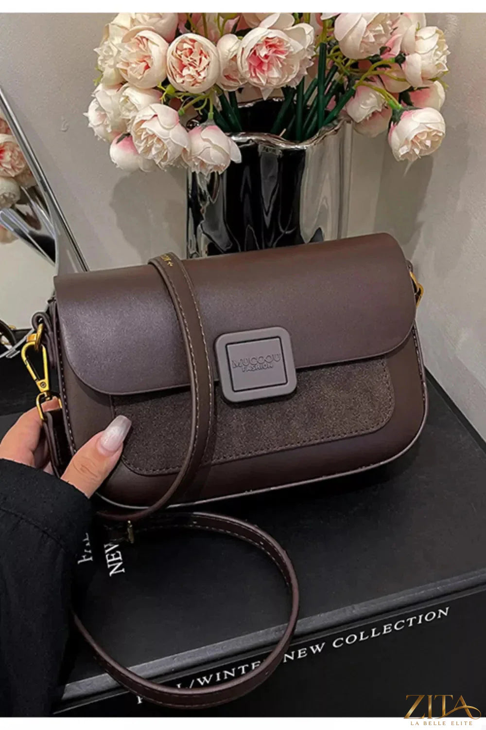 Zita La Belle Elite flap closure shoulder bag in sleek design with adjustable strap and leather exterior.