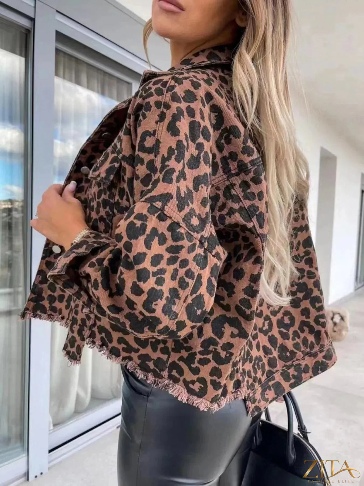 Leopard print raw hem denim jacket by Zita La Belle Elite, showcasing stylish raw edges and bold animal print fabric.