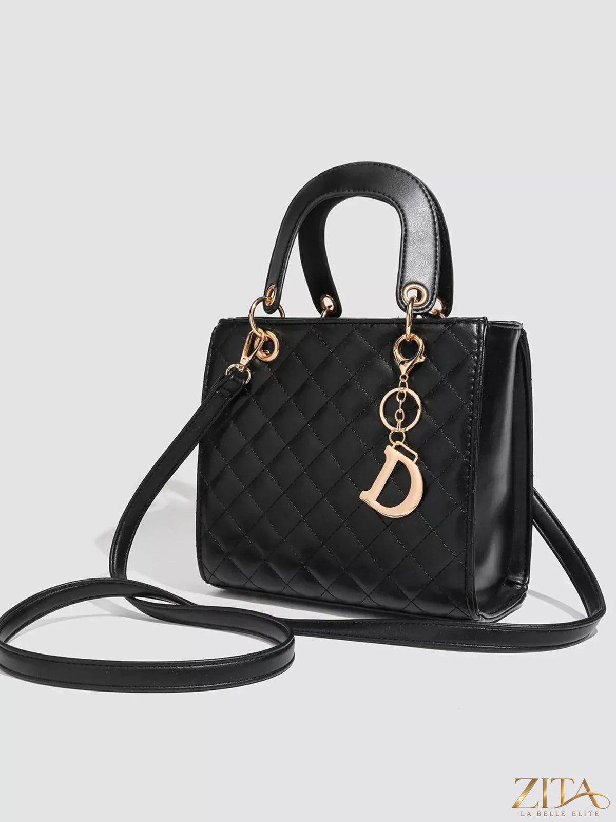 Zita La Belle Elite quilted top handle handbag in black with gold-tone hardware and a sleek, elegant design.