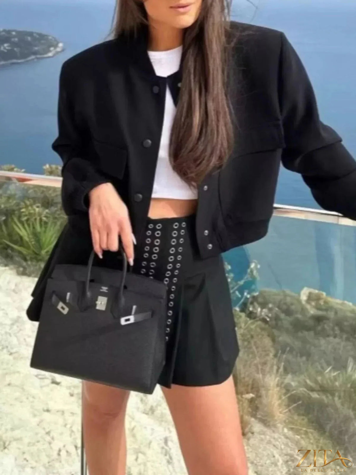 Zita La Belle Elite snap-down cropped bomber jacket featuring a sleek design and front snap closures, styled on a model.