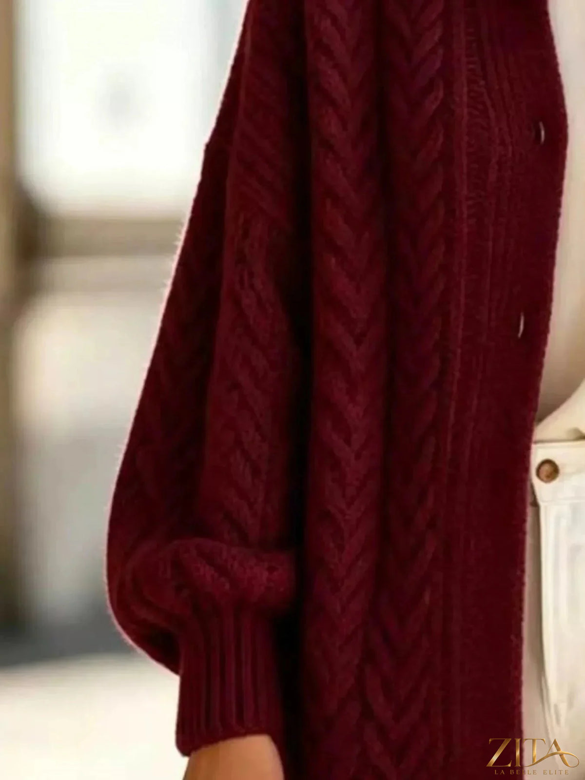 Plus size cable-knit button-down cardigan by Zita La Belle Elite, featuring a full-size, cozy knit with a front button closure.