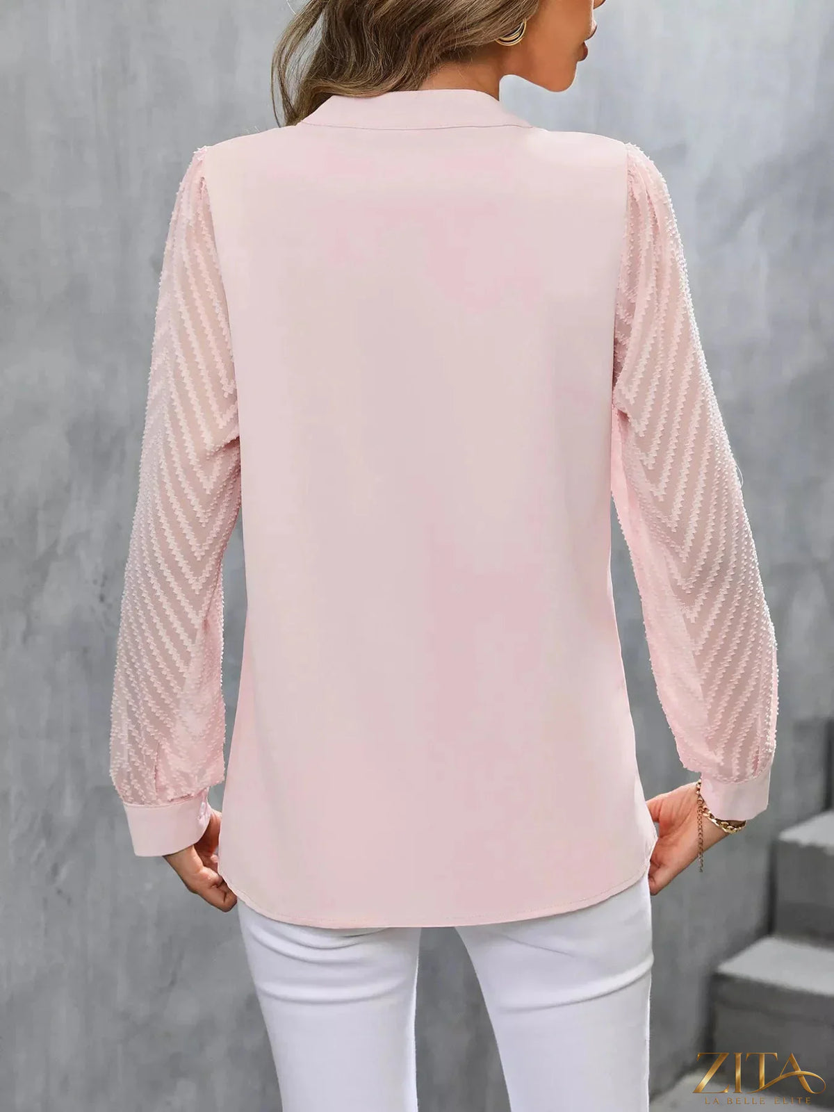 Sheer sleeve V-neck blouse by Zita La Belle Elite, featuring lightweight fabric and elegant design with a V neckline.