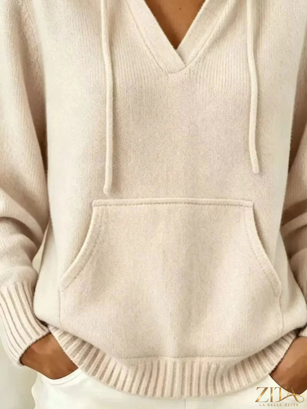 Gray hooded sweater with kangaroo pocket and trendy design, featuring a comfortable fit and casual style by Trendsi.