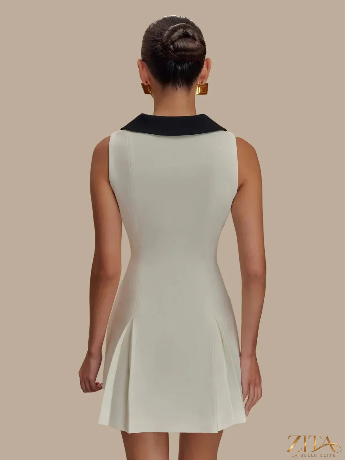 Sleeveless mini dress with button front from Trendsi, featuring a fitted silhouette and casual style, shown on a model.