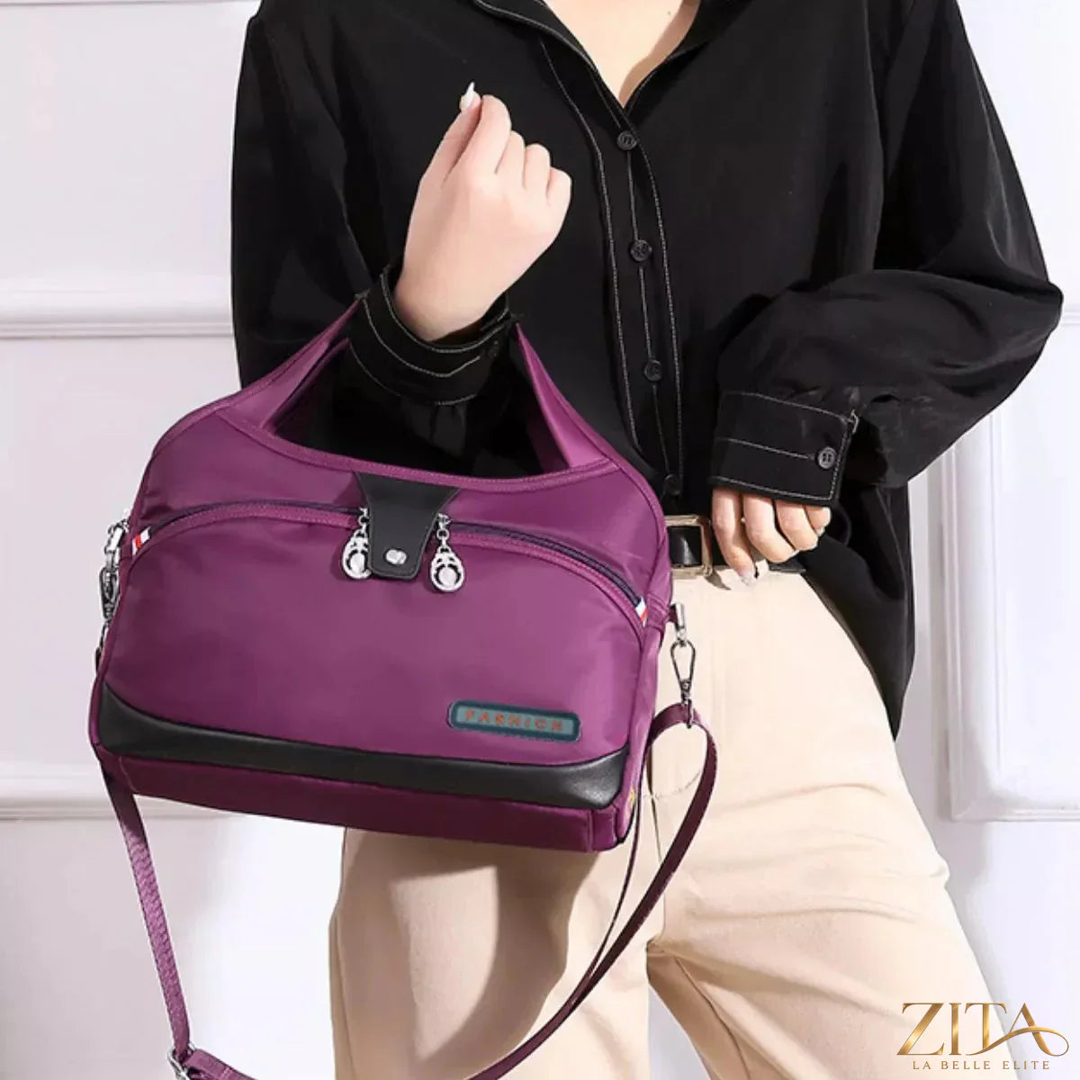 Zita La Belle Elite lightweight nylon handbag with multiple pockets, showing side view with zipper closures and adjustable strap.
