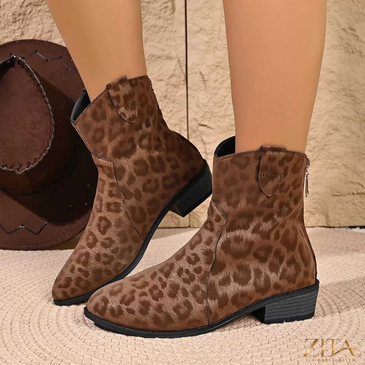 Leopard print Western ankle boots by Trendsi featuring pointed toes, stacked heels, and a stylish western-inspired design.