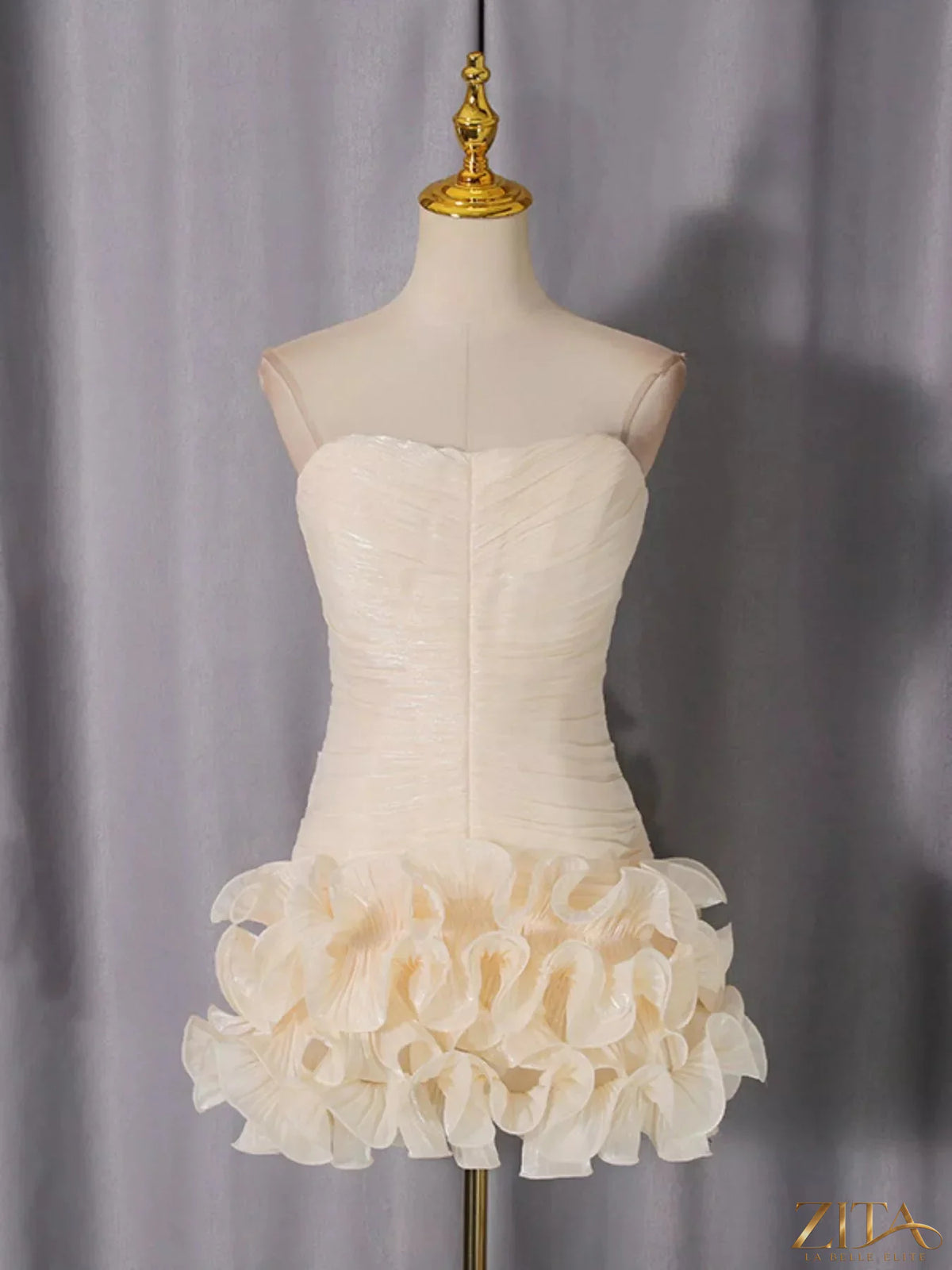 Strapless ruffle ruched mini dress by Trendsi, featuring a fitted bodice with layered ruffle details and a short flared skirt.