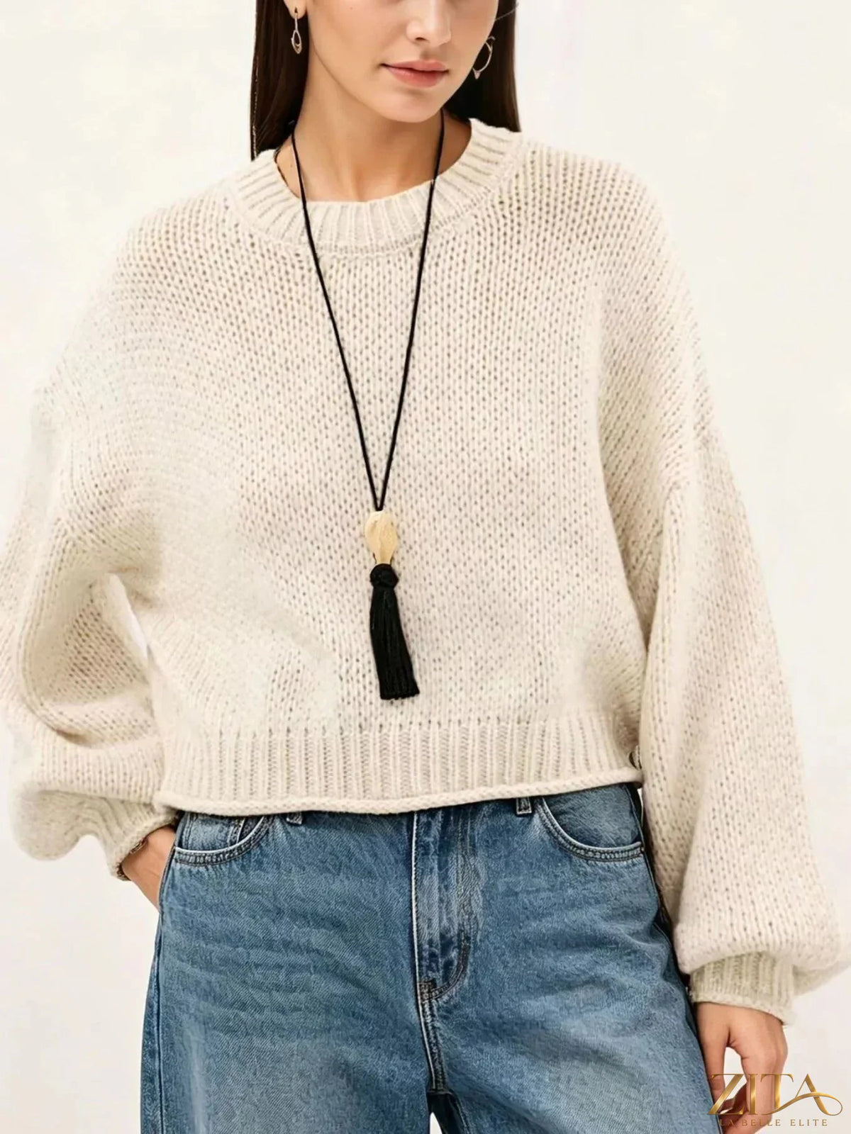 Oversized chunky knit sweater by Trendsi in soft beige, featuring a cozy, relaxed fit and chunky textured knit pattern.