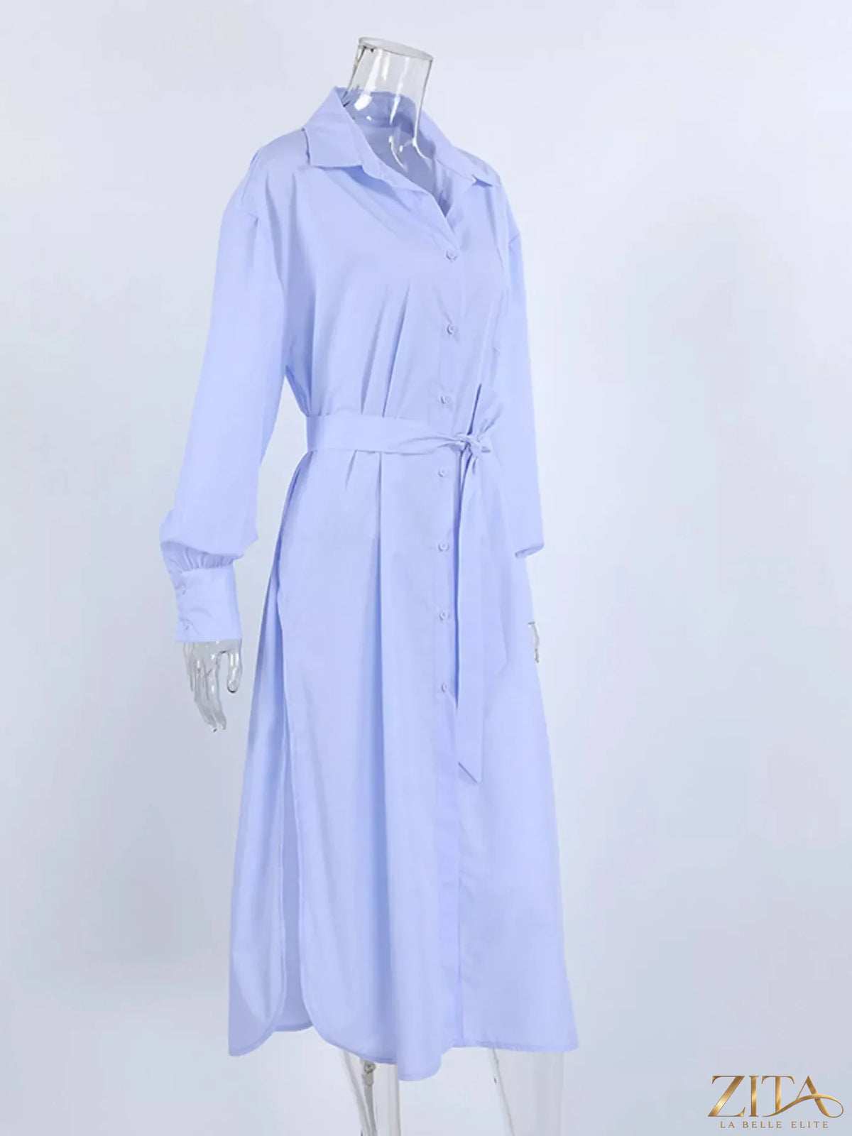 Longline button-down shirt by Zita La Belle Elite, featuring a relaxed fit and classic collar, shown in a neutral fabric.