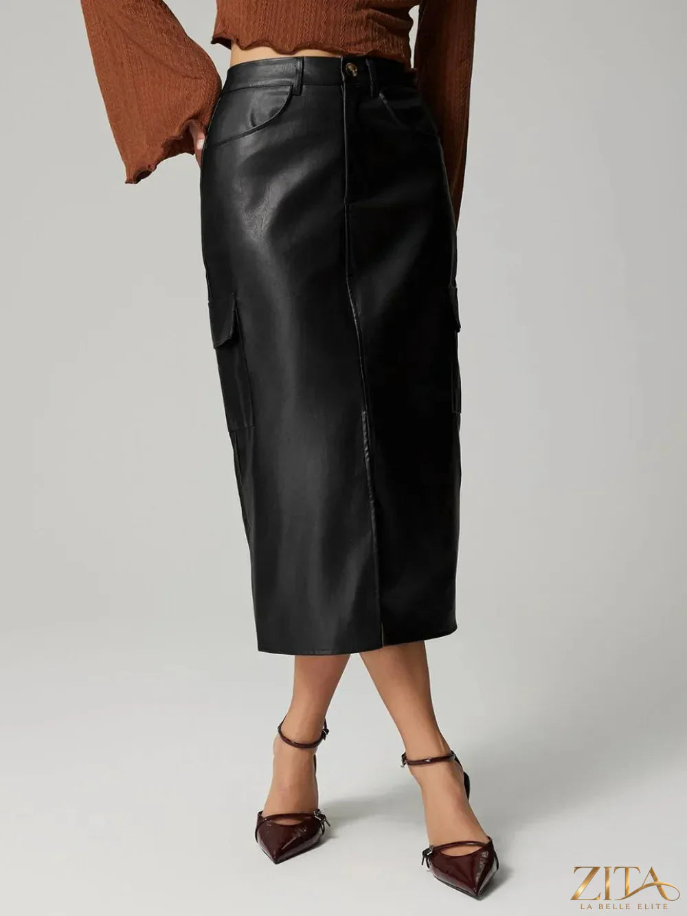Black slit midi skirt with pockets from Trendsi, featuring a flowy design and stylish slit detail.