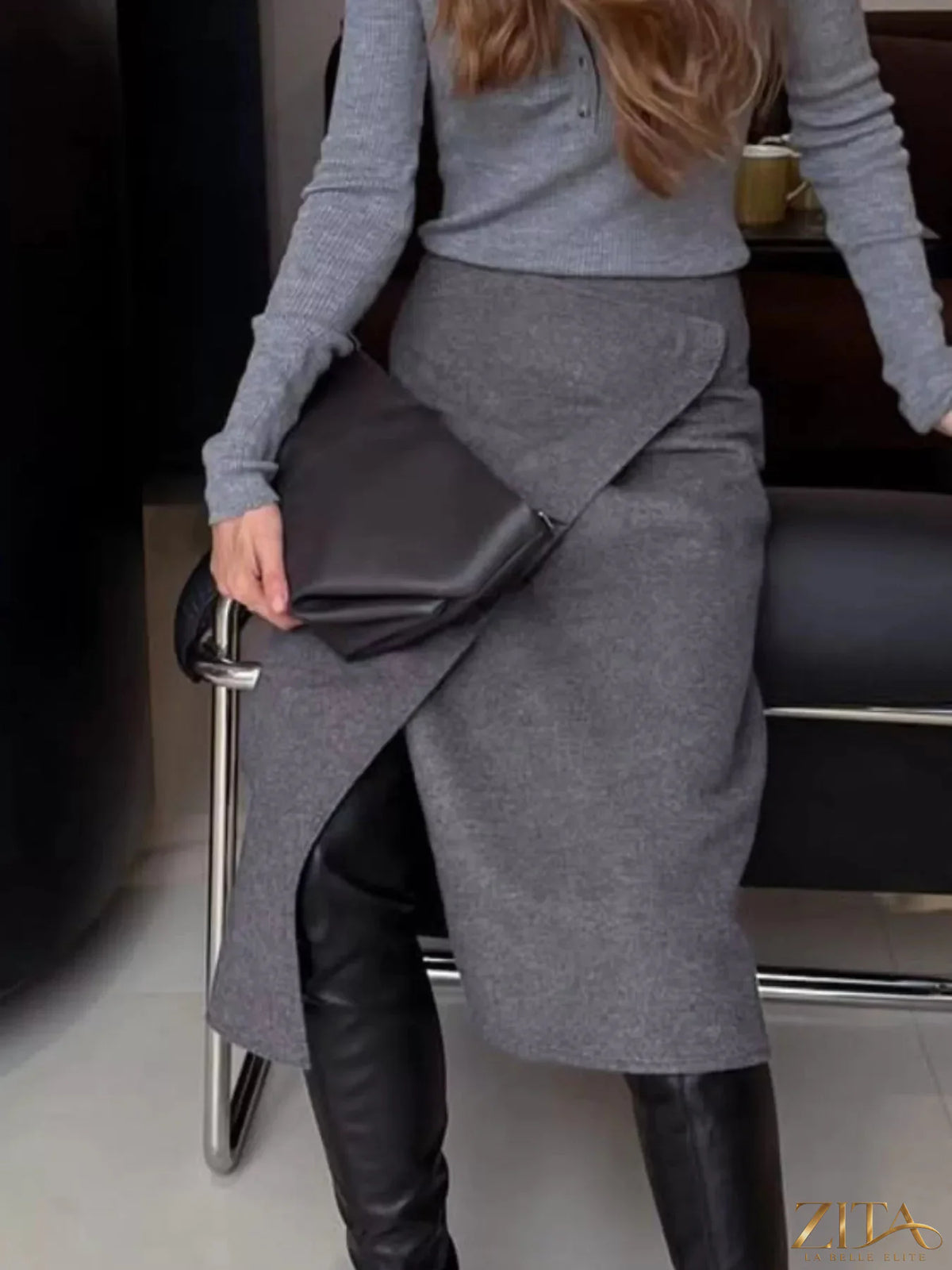 High-waisted wrap midi skirt from Trendsi featuring a stylish design, flowing fabric, and a flattering silhouette.