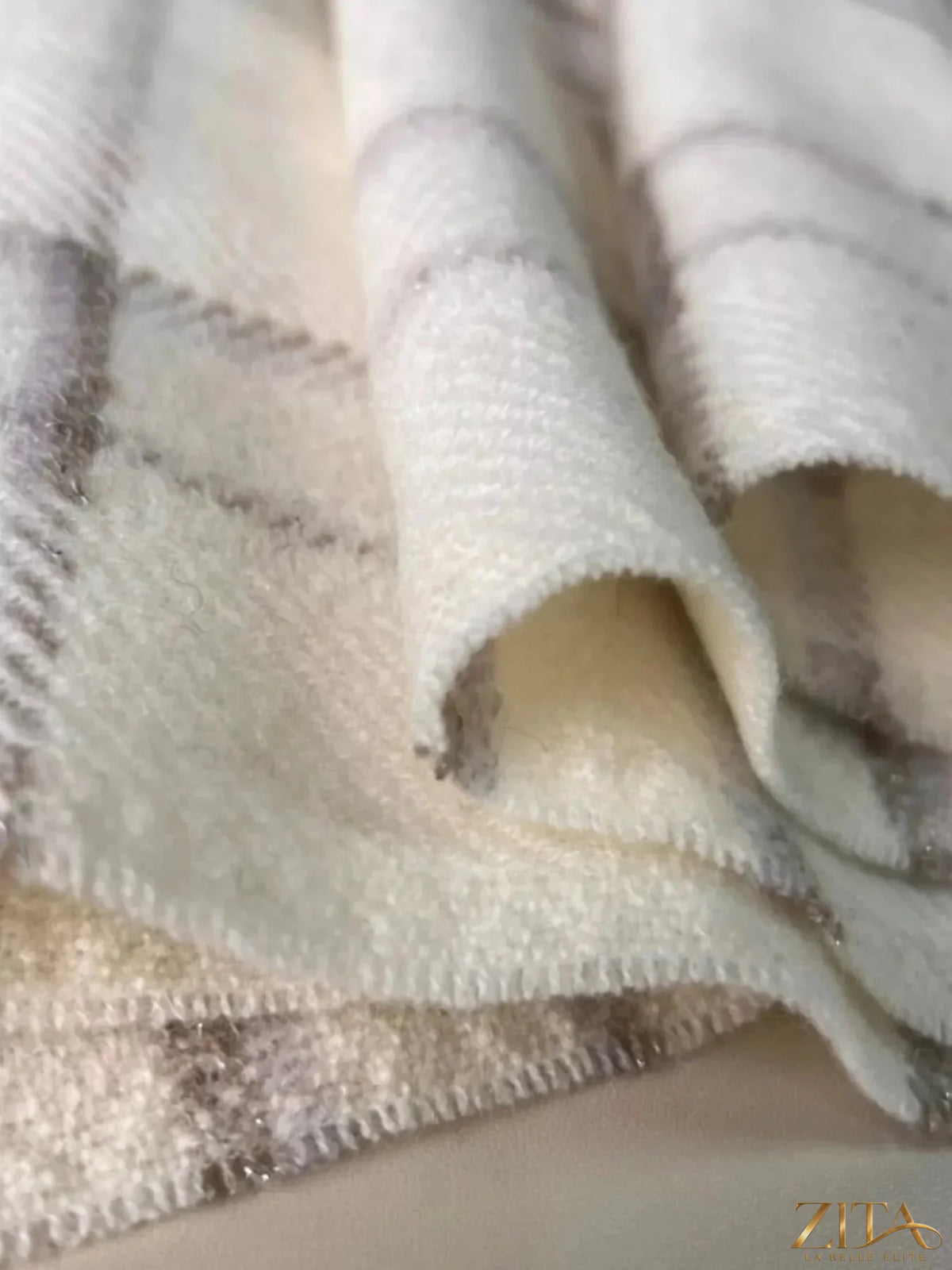 Zita La Belle Elite 100% wool raw hem plaid scarf featuring a classic pattern and soft, warm texture for stylish winter wear.