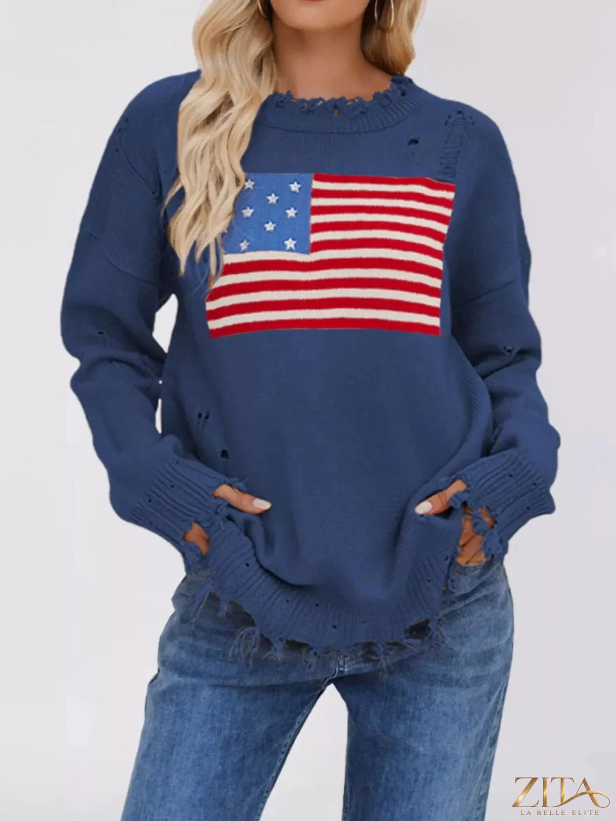 Distressed American flag graphic sweater by Trendsi featuring a cozy knit with a vintage-inspired flag design.