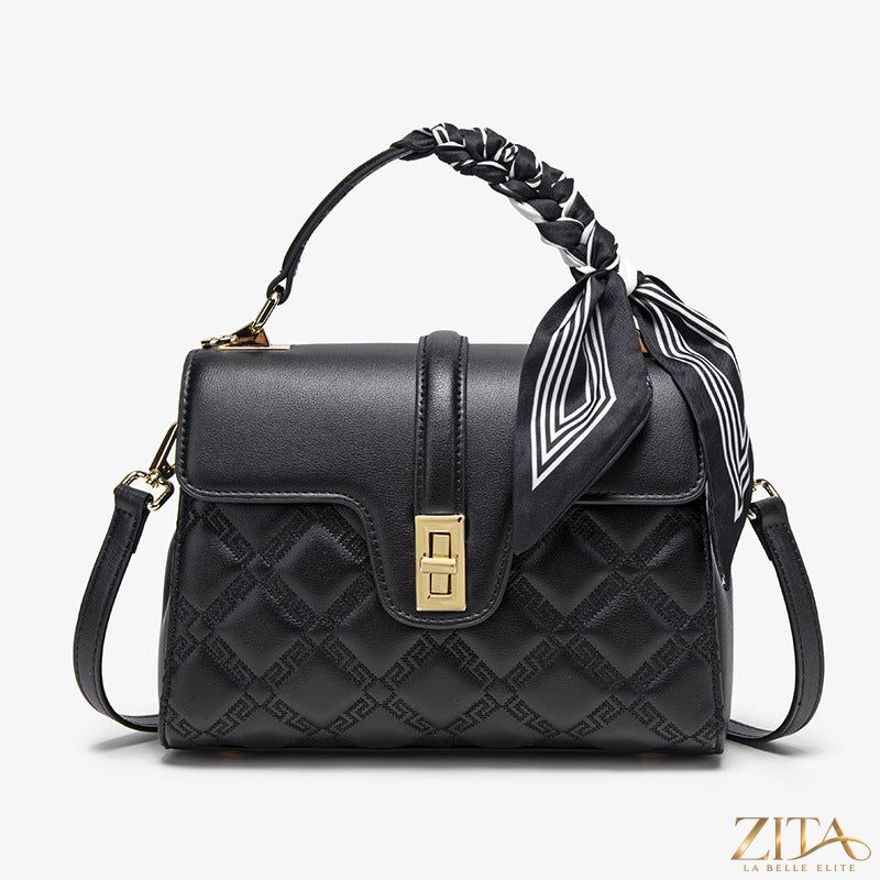 Trendsi quilted leather crossbody bag with adjustable strap and zippered pocket, showcasing a stylish and functional accessory.