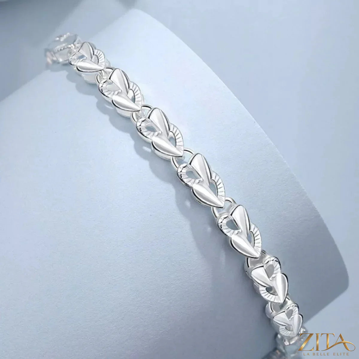 Sterling silver heart link bracelet featuring interconnected heart-shaped links, crafted with high-quality 925 sterling silver.
