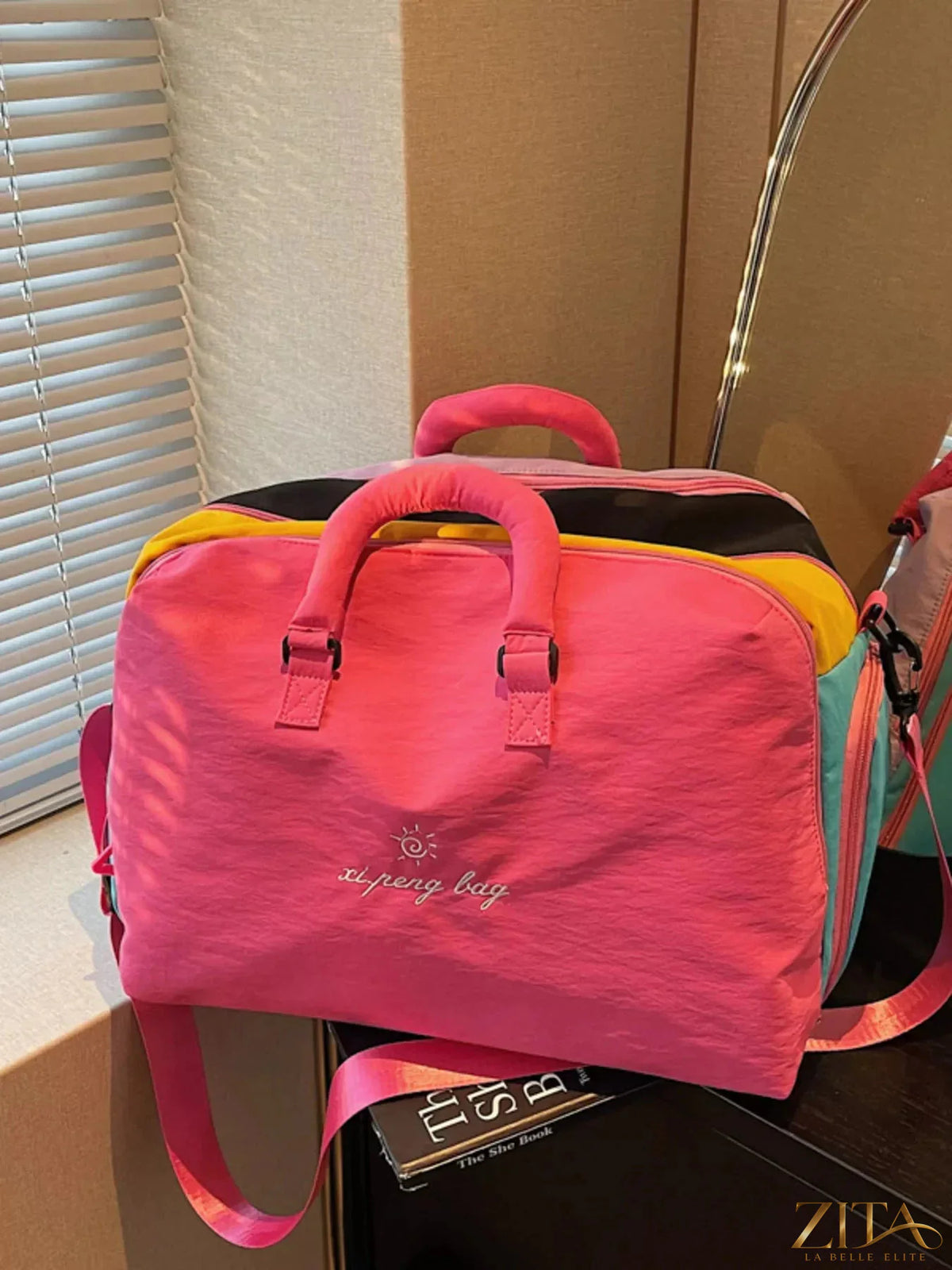 Colorful lightweight travel duffel bag by Zita La Belle Elite, showing vibrant design and spacious interior for easy packing.